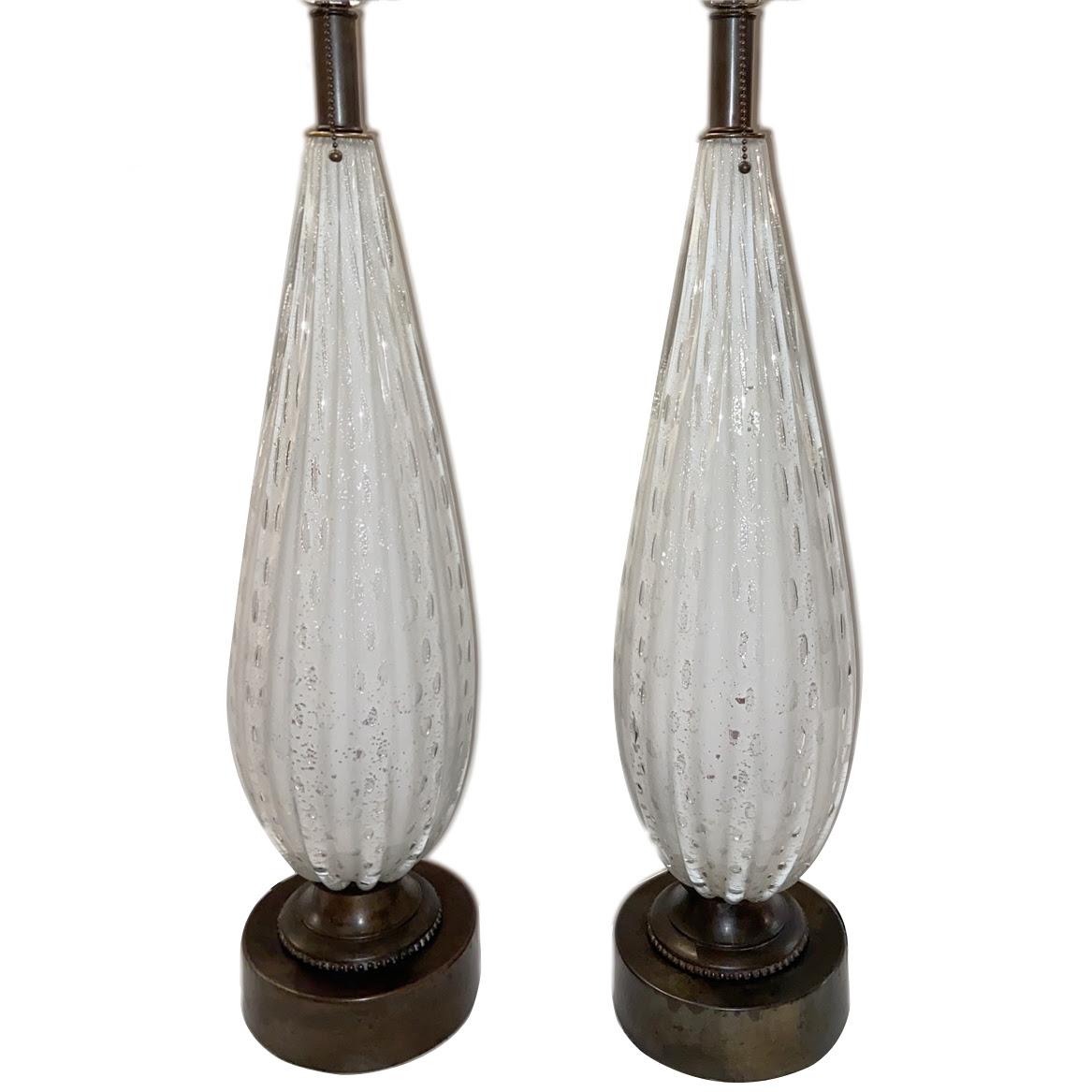 A pair of circa 1950’s Murano glass table lamps

Measurements: Height body: 24″ Height to shade: 36″