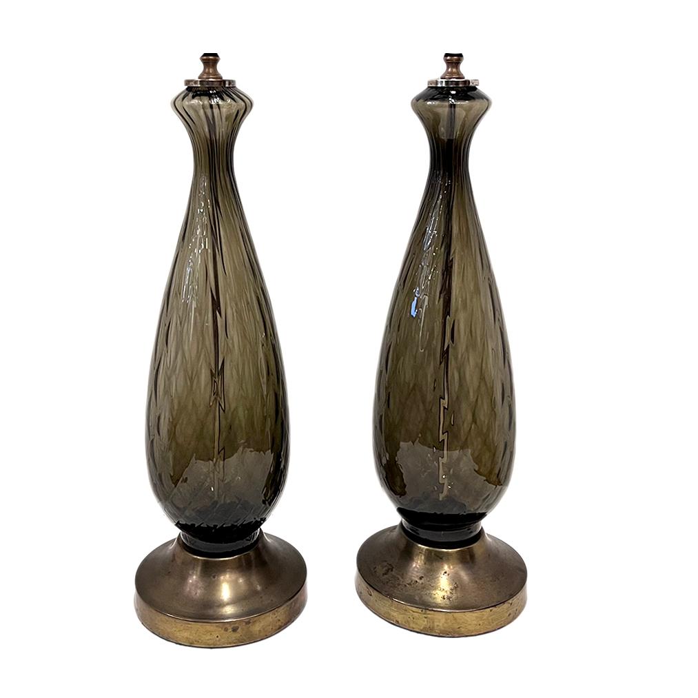 Pair of circa 1960's smoke color Italian blown glass lamps.

Measurements:
height of body: 20