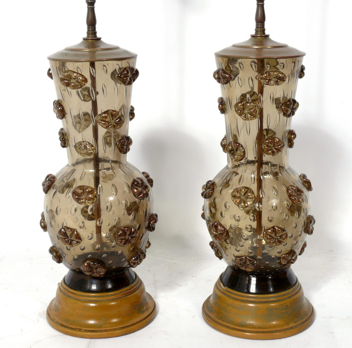 Pair of Murano glass lamps, Italy, circa 1960s. They are a champagne-brown color. They have been rewired and are ready to use. The price noted includes the shades.