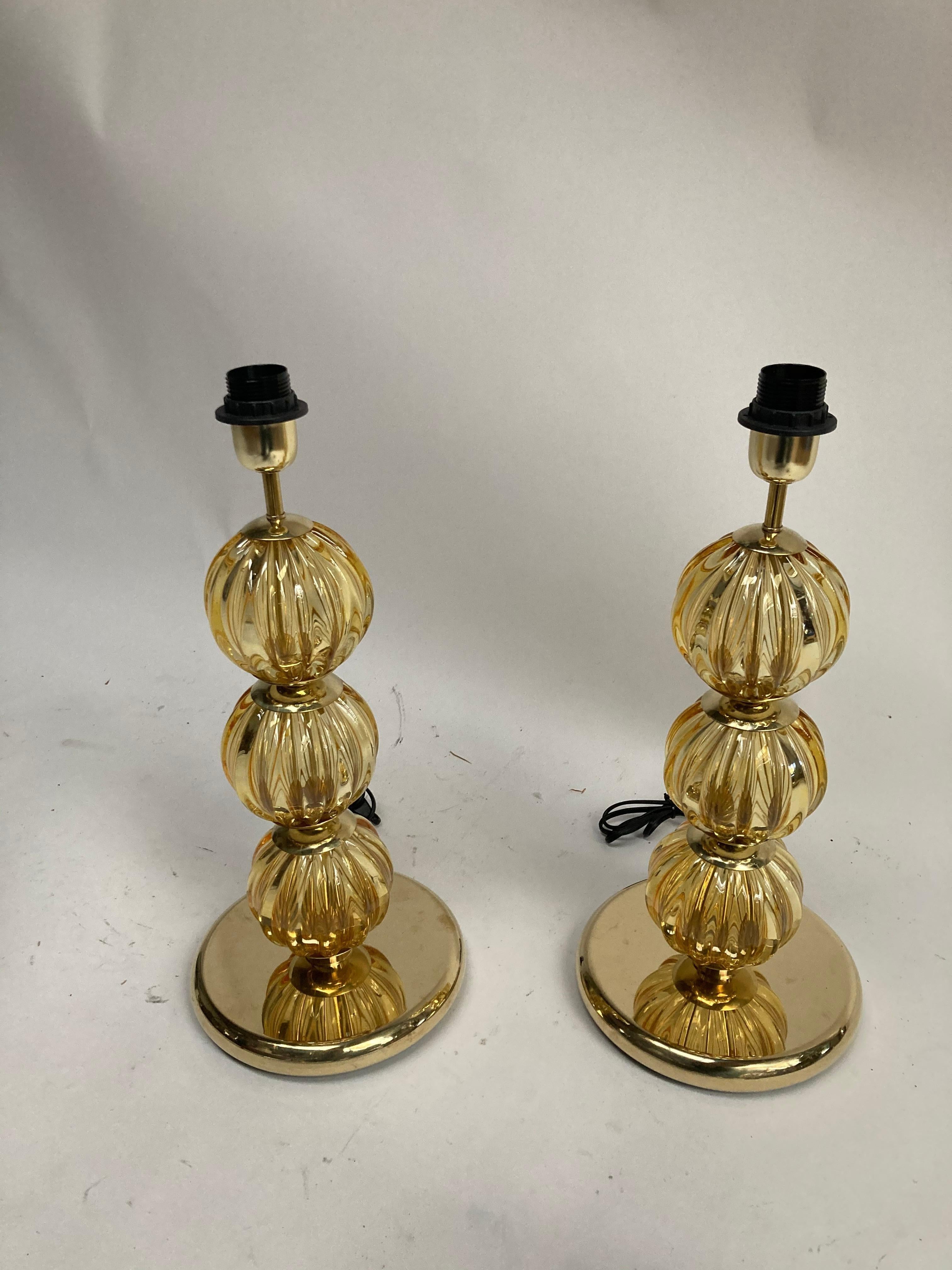 Pair of Murano glass lamps with polished brass base
Italy
1970's
Dimensions given without shade
No shade provided.