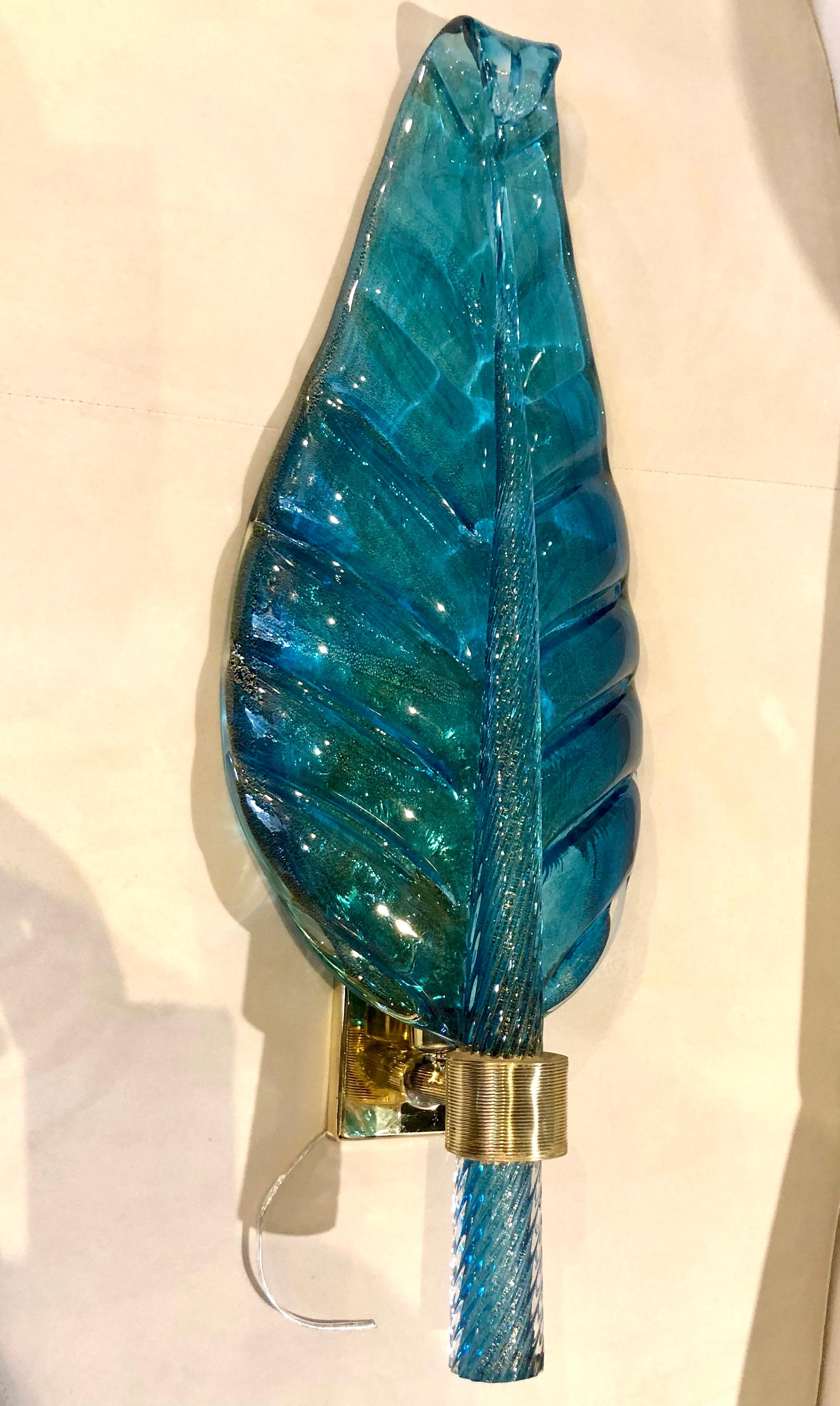 Rare blue murano glass leaf-form wall lights by Barovier & Toso. Italian, circa 1960. Each light is in the form of a leaf with a spiral twisted stem and set on gilt backplates. The reverse of the glass is made with a 'Rugiadoso' technique,