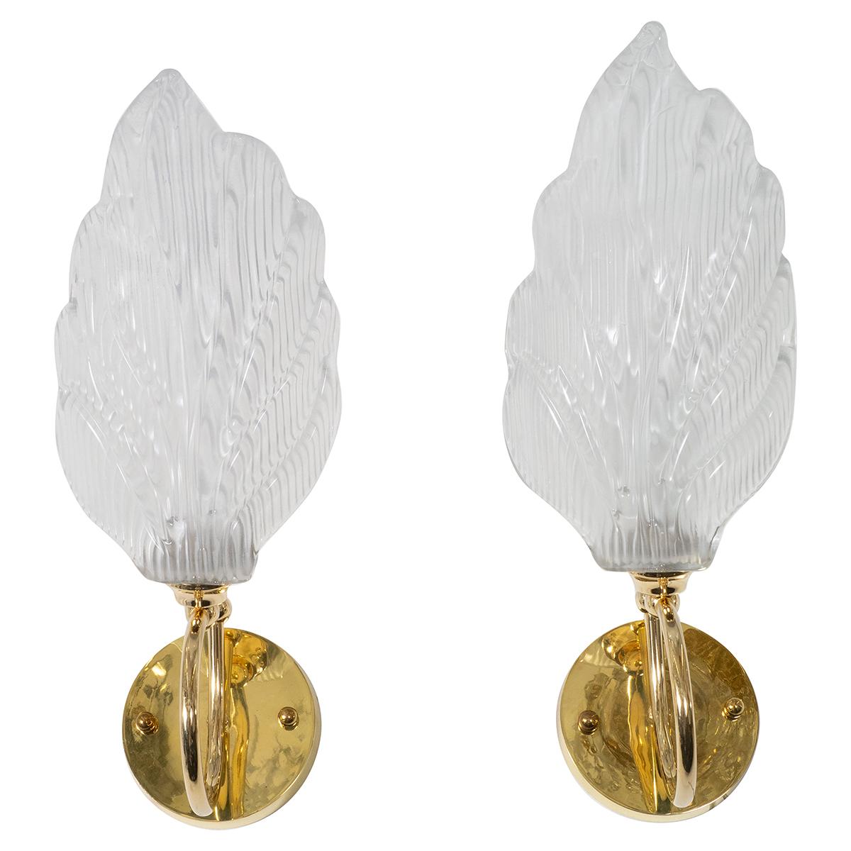 Pair of brass wall sconces with textured Murano glass leaf shades.