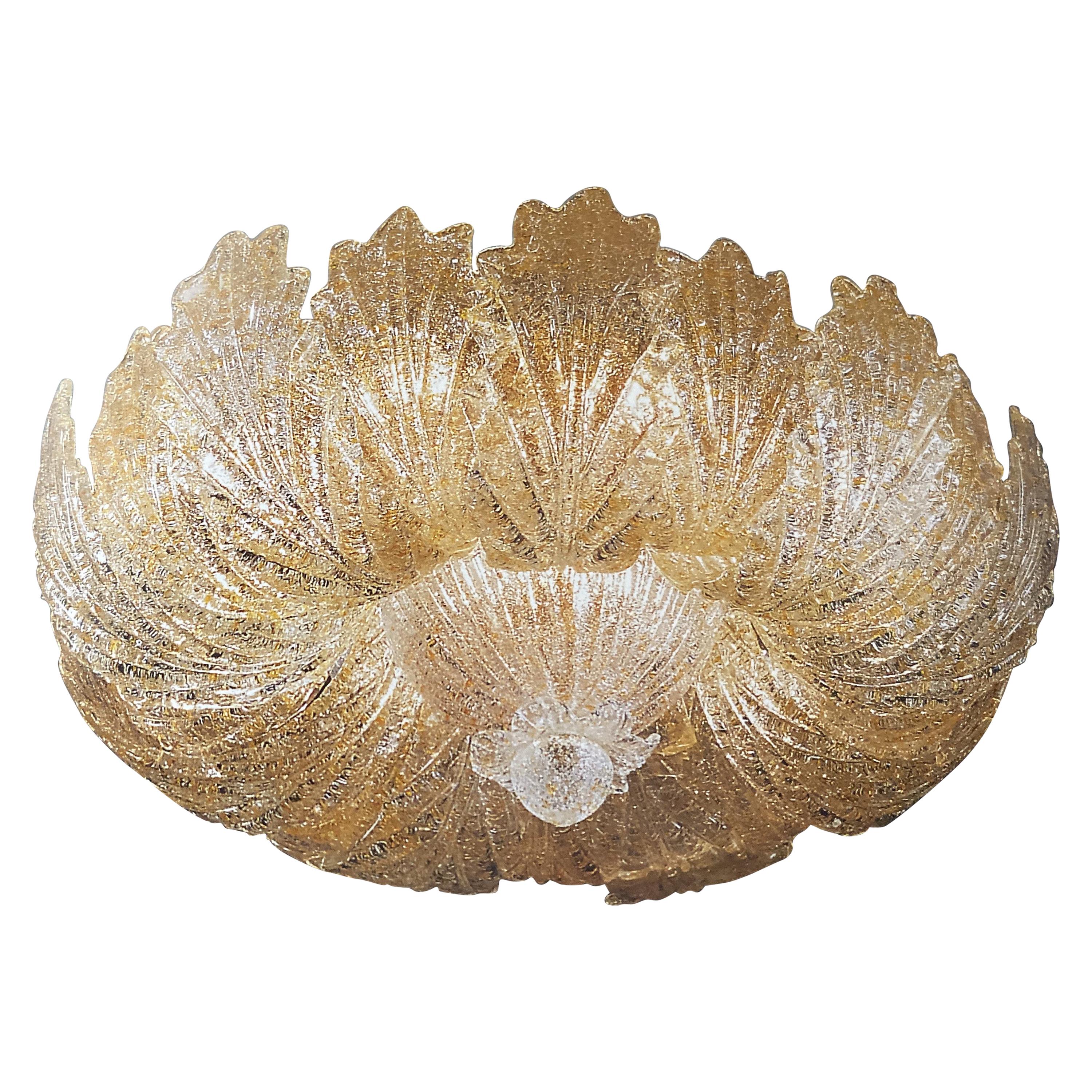 This ceiling light realized in pure Murano glass leaves with gold intrusion. Available also with clear graniglia leaves.
Amazing 24-carat gold-plated structure and canopy.
This beautiful ceiling light gives an elegant Ambience a special flair and