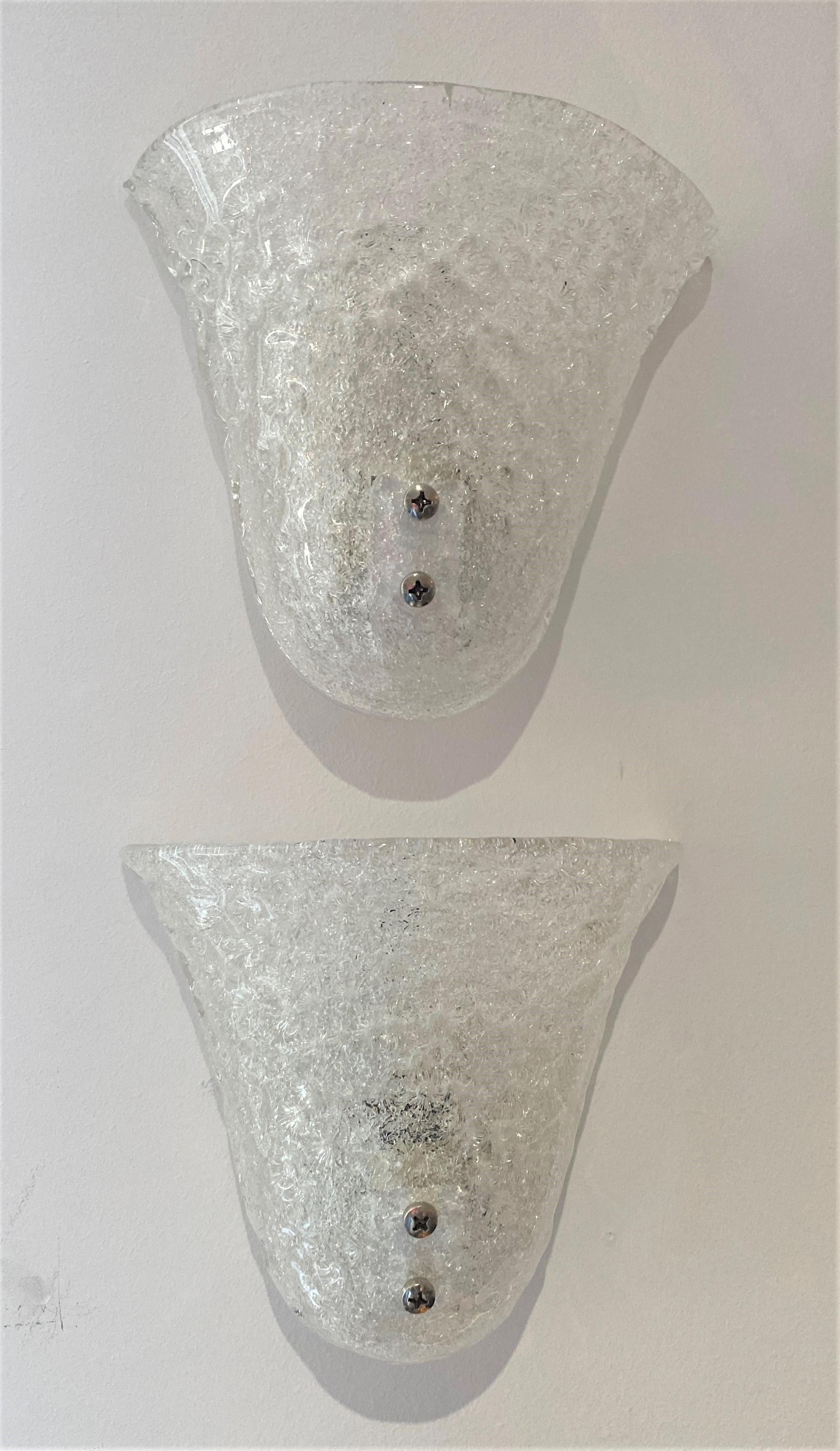 This stylish pair of Murano glass wall sconces date to the 1960s-1970s.

Note: They can be hung either way, up or down (see last image).

Note: Because these are handmade, there is slight variation in size, for example, the width varies from
