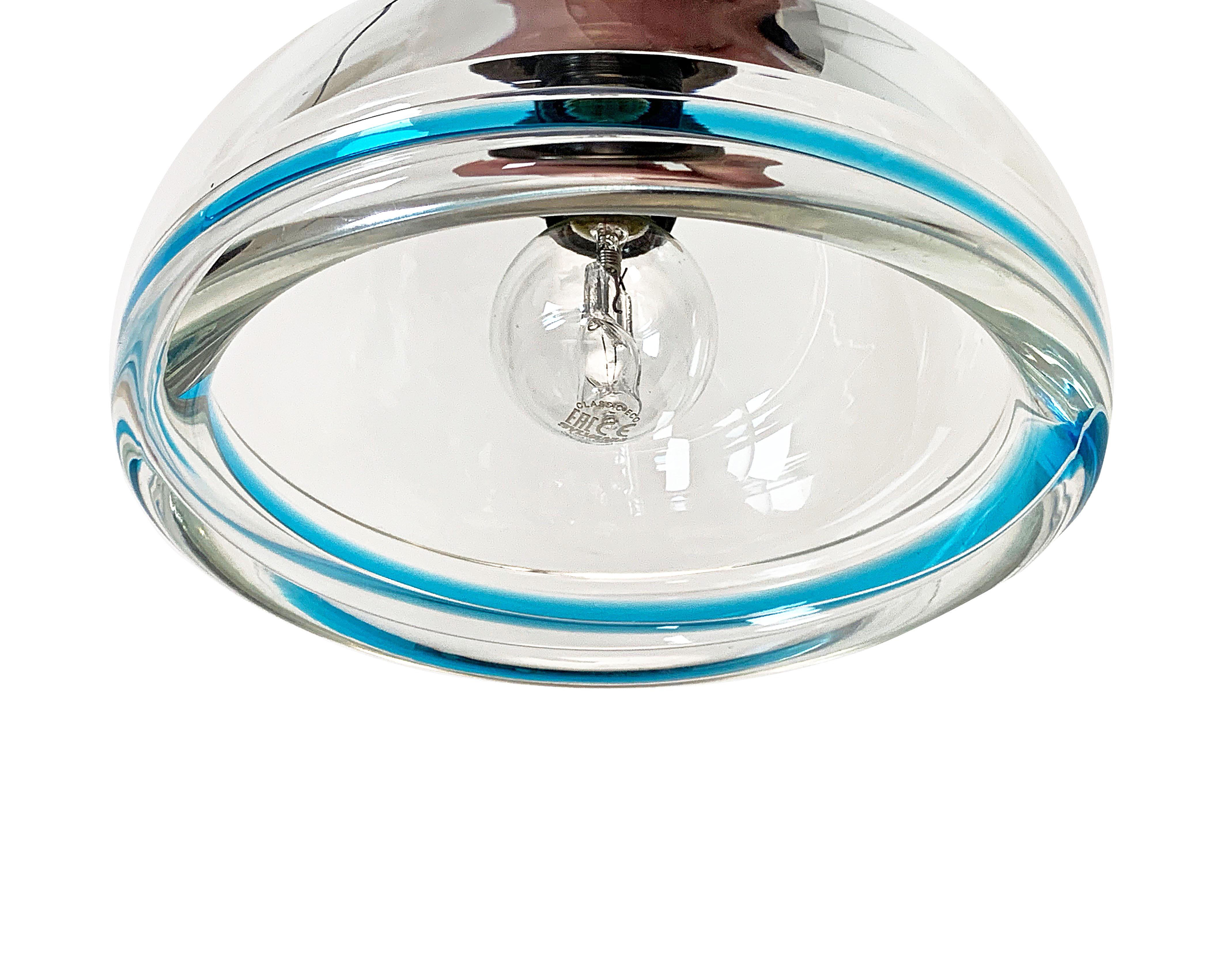 Superb pair of pendants in very thick glass of Murano. The edge of a beautiful blue color that emphasizes the lamps. Lamps in perfect condition. Ready to be cleaned. The electric service is new and mounts a bulb with a small E / 14 connection.