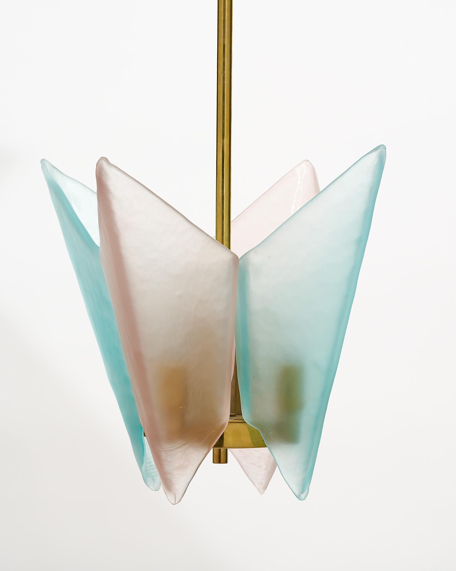 Pair of Murano glass pendants from Italy. Each fixture features two pieces of light pink and two pieces of light blue hand-blown glass components hanging from a gilt brass structure. They have been newly wired to fit US standards.