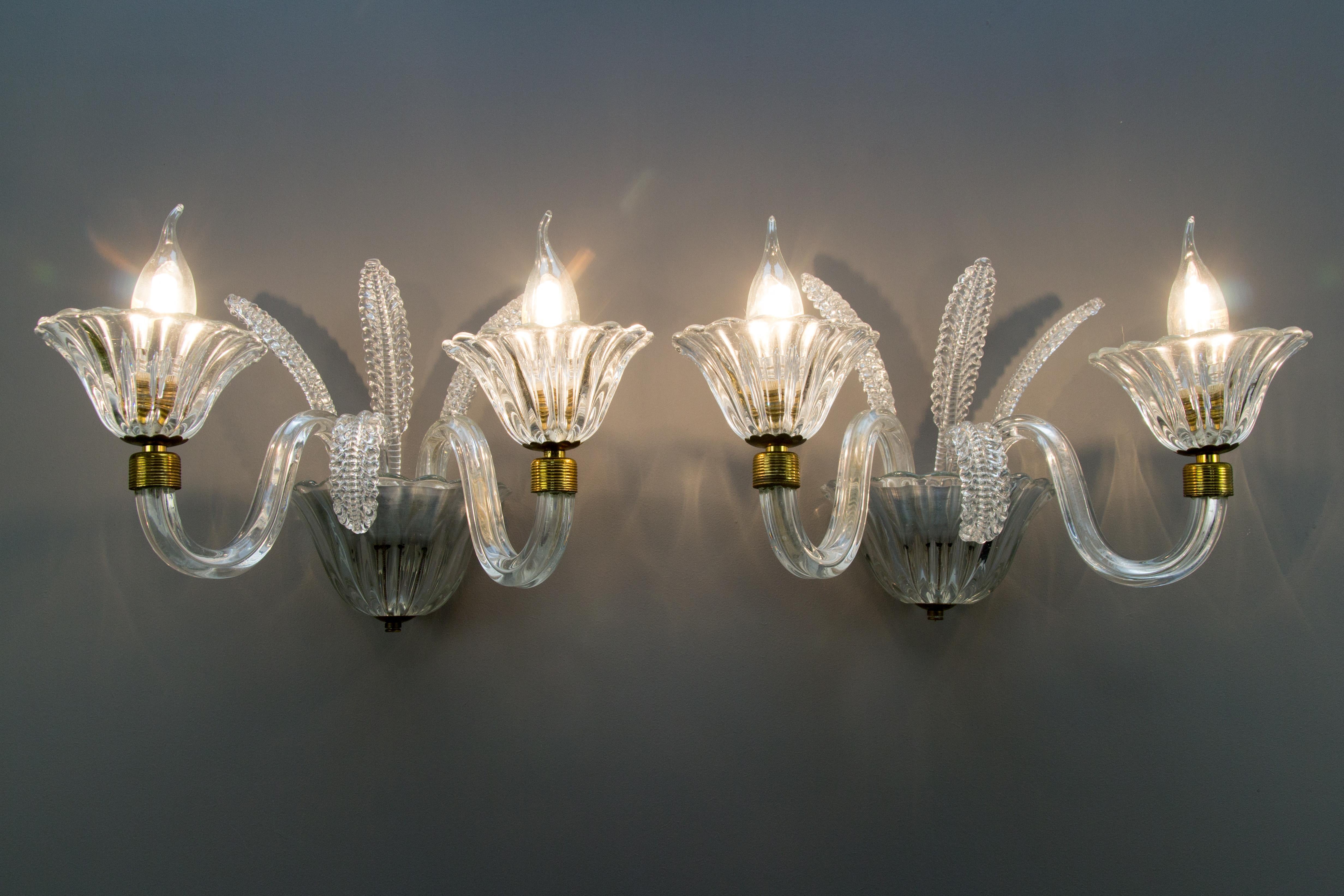 Pair of beautiful Italian Murano glass sconces, clear glass. Each sconce has two branches with sockets for E 14 size light bulbs.
Dimensions:
Height 24 cm / 9.44 in, width 40 cm / 15.74 in, depth 26 cm / 10.23 in.