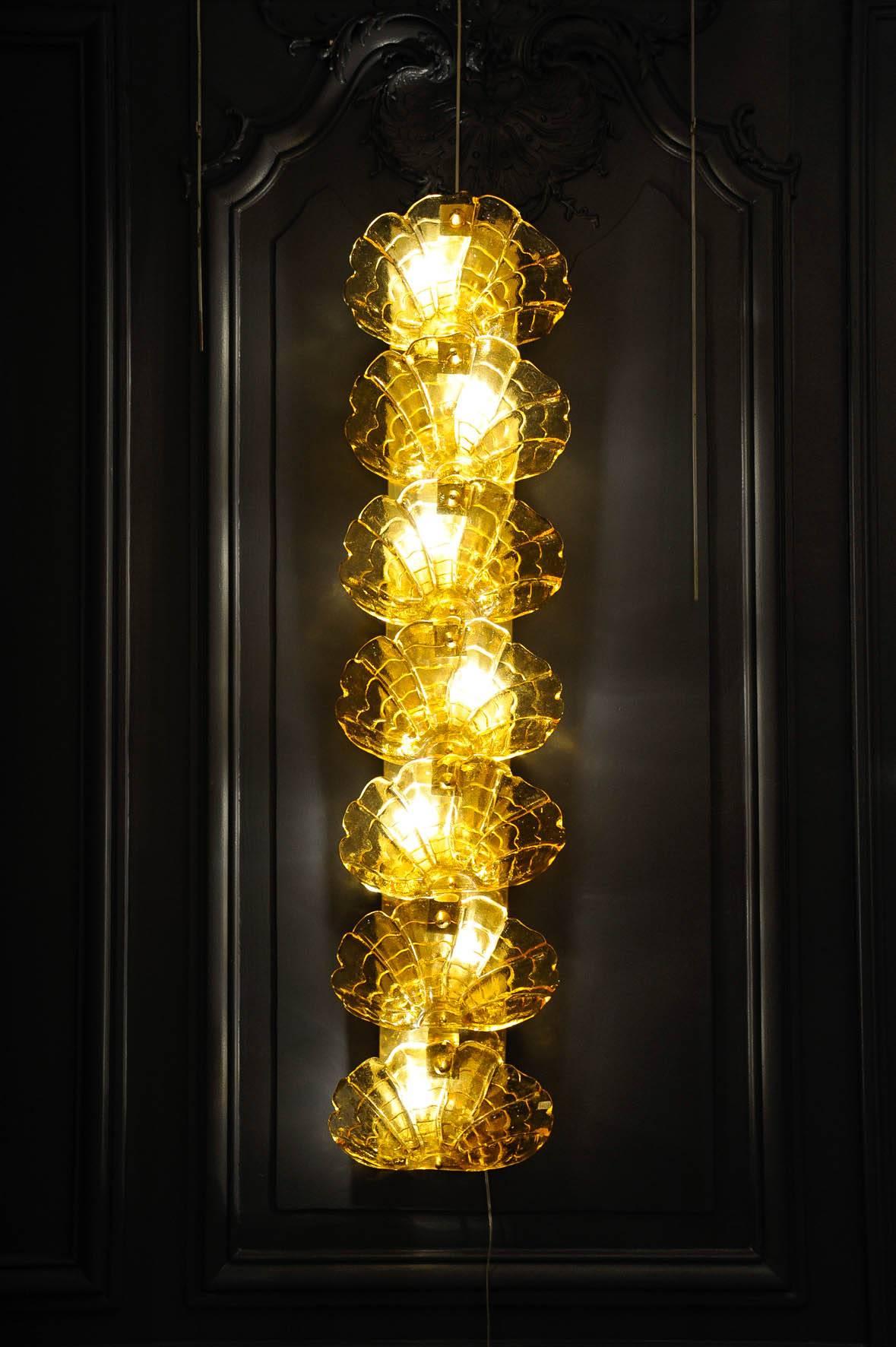 Pair of brass and gilt Murano glass shells, six bulbs per sconce.