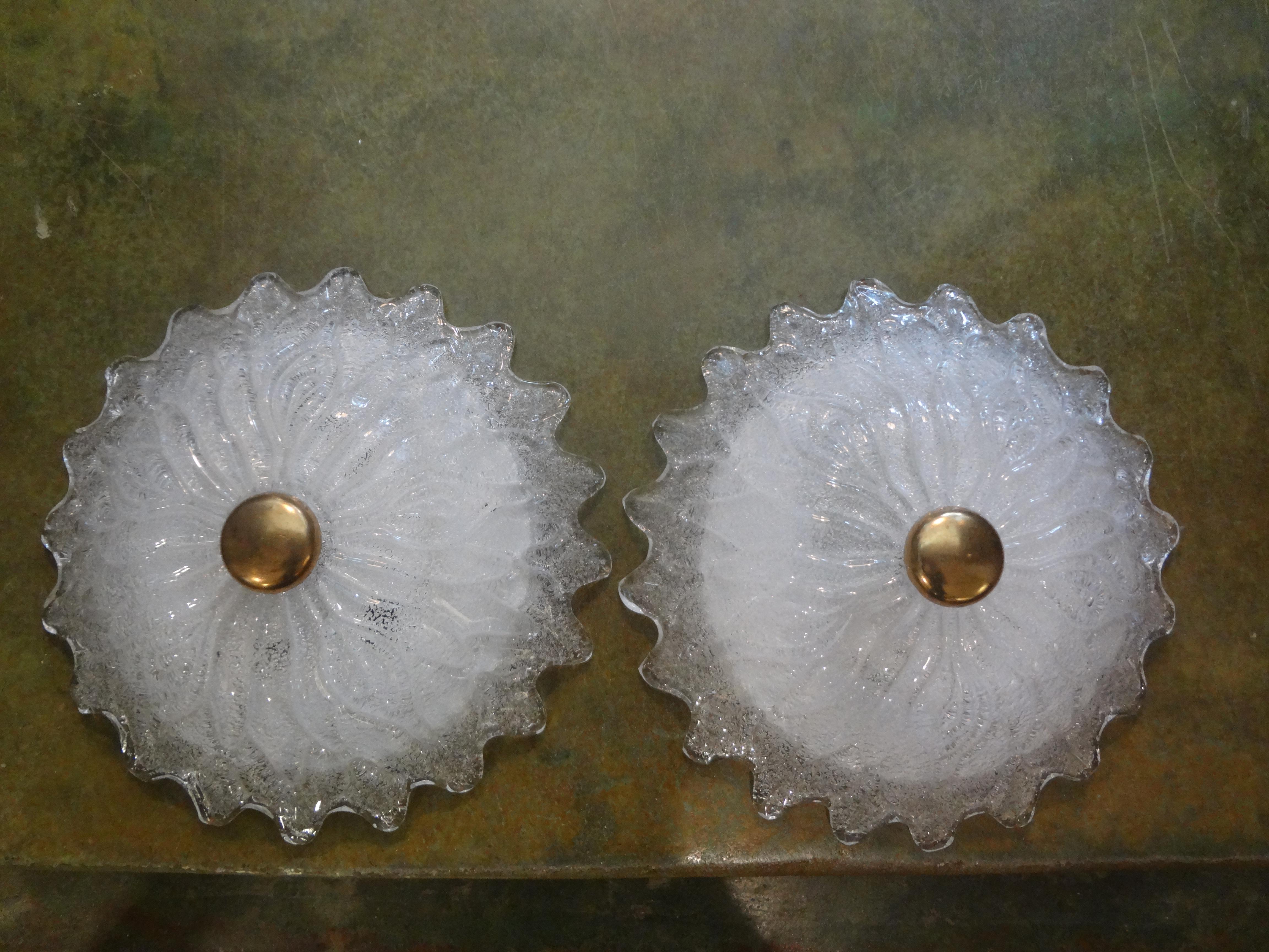 Unusual pair of Murano glass and brass flower sconces by Barovier. These stunning Italian glass sconces have been newly wired for the U.S. Market. This vintage pair of white Murano glass sconces date to the 1980s. These Mid-Century Modern Murano