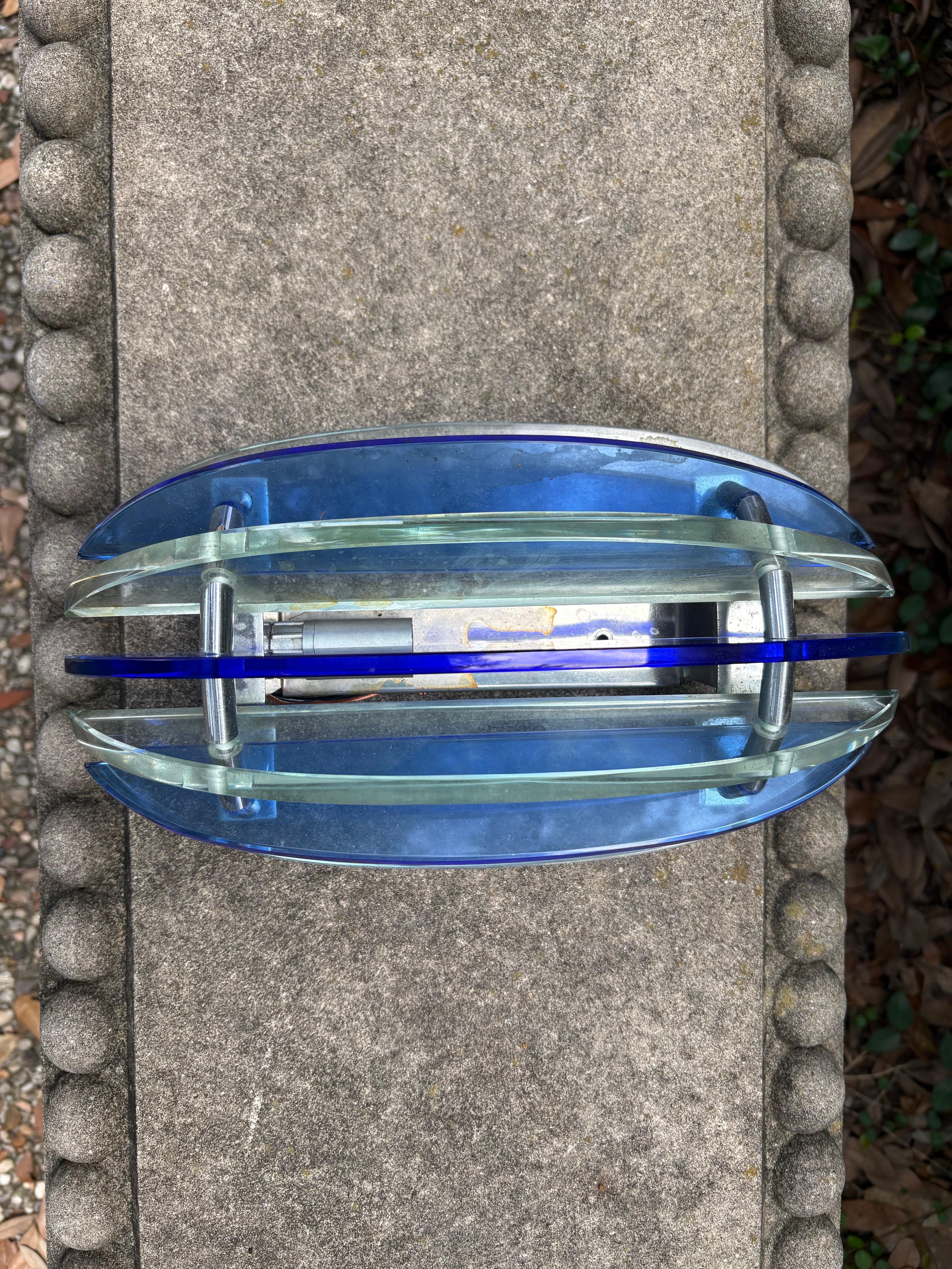 Pair of Murano Glass Sconces by Veca.
This lovely pair of Italian sconces have cobalt blue and transparent glass panels mounted on chromed steel frames.
Each sconce has been newly wired with new sockets for the U.S. market.
Italian modern lighting
