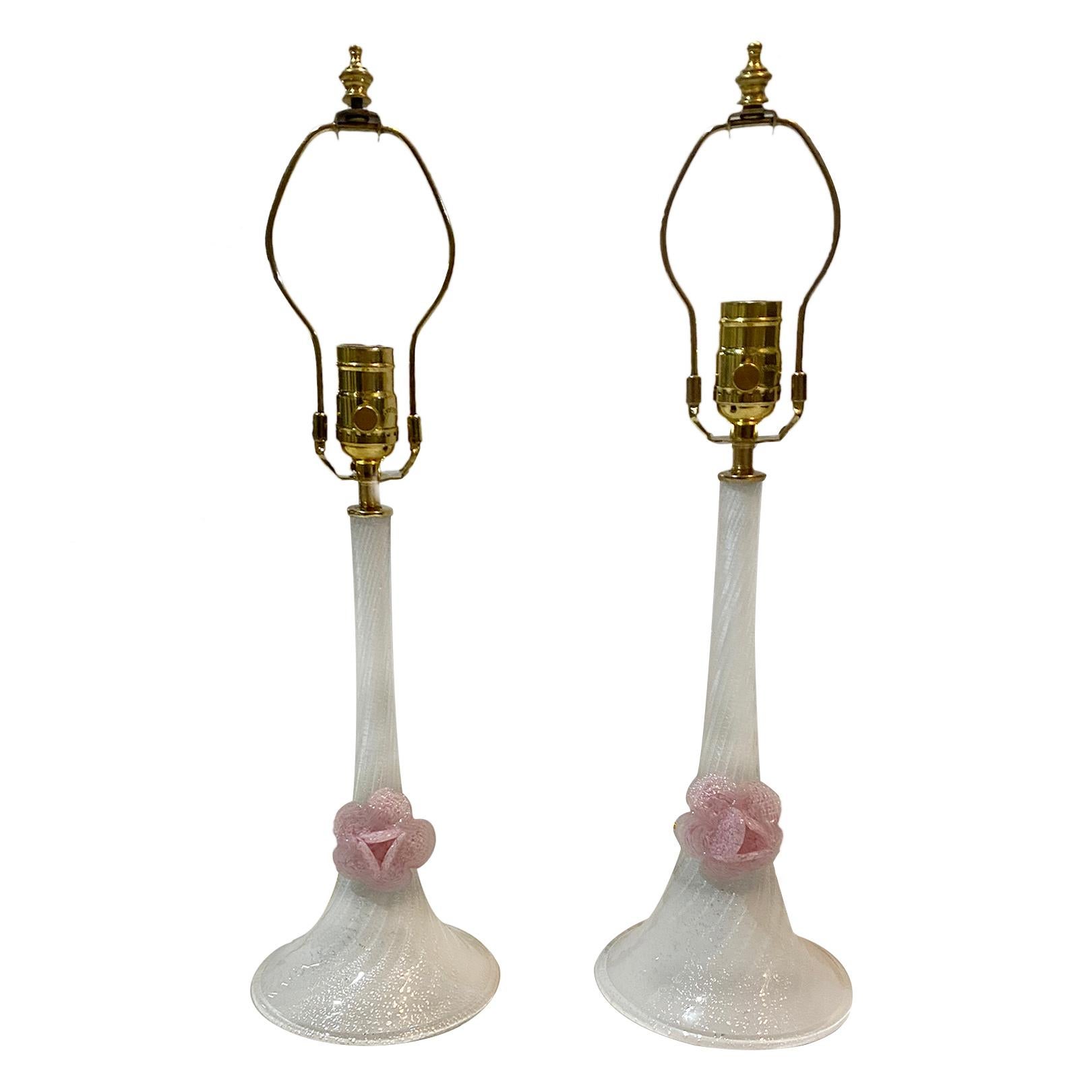 A pair of circa 1960's Italian hand-blown Murano glass table lamps in white with floral motif.

Measurements:
Height of body: 12.25