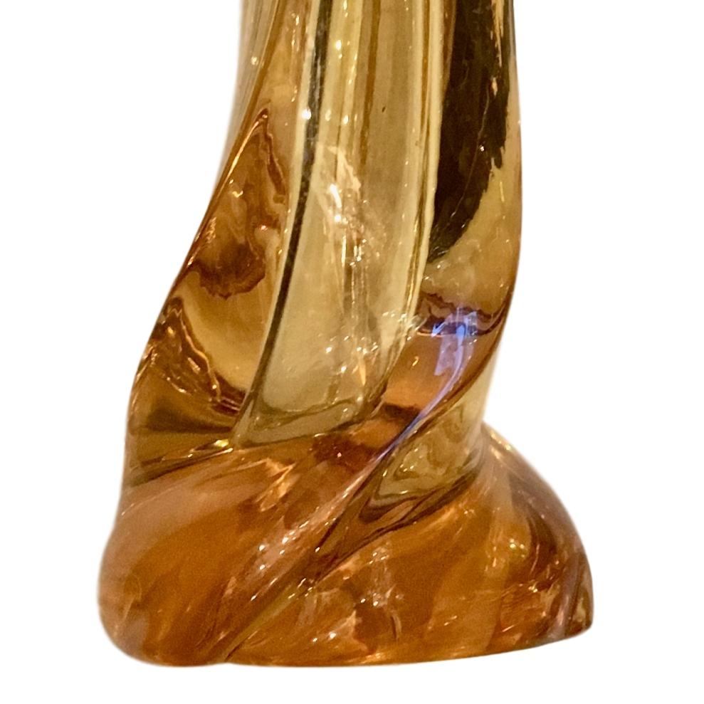 A pair of circa 1950s hand blown amber Italian Murano glass table lamps.

Measurements:
Height of body: 14
