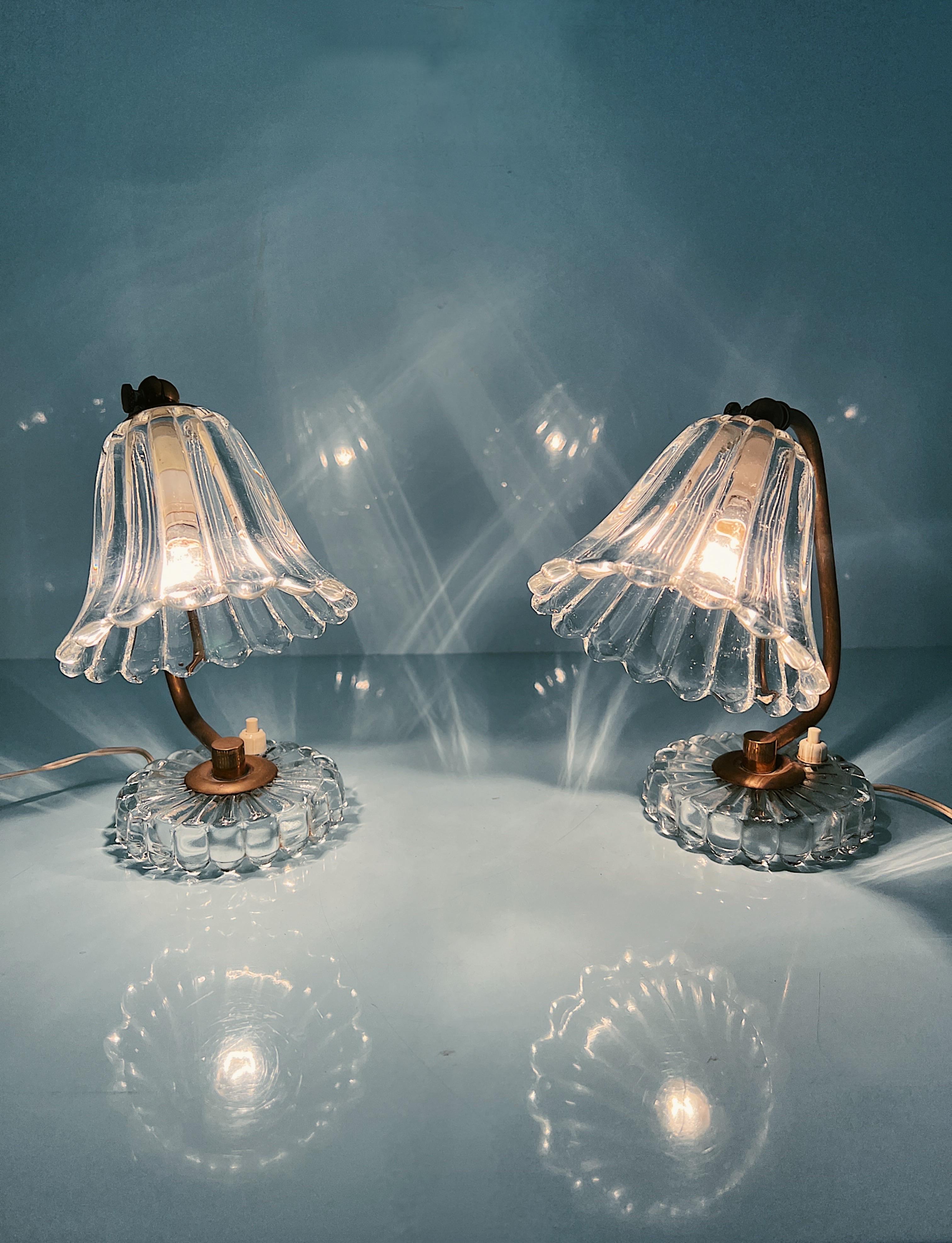Sweet Pair of Vintage Barovier and Toso Table Lamps (Abat-Jour) from the 1940s.

Perfect for your bedside table. Crafted by Barovier and Toso, renowned artisans of their time, these lamps exude timeless elegance.

Featuring a convenient light switch