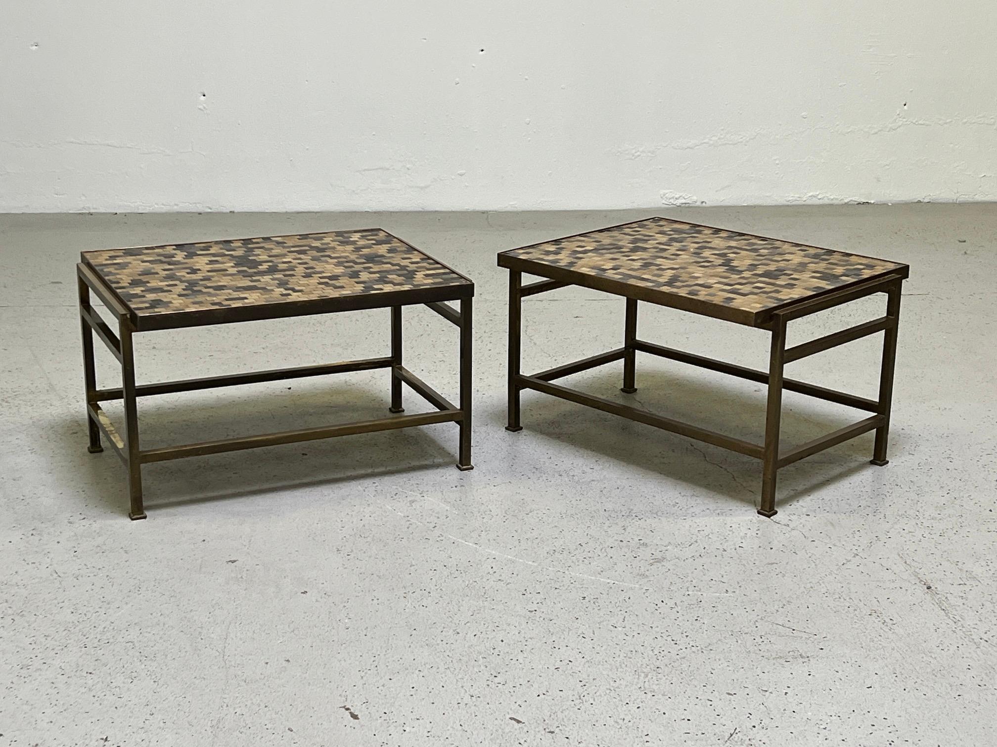 A pair of brass tables with Murano glass table tops designed by Edward Wormley for Dunbar.
