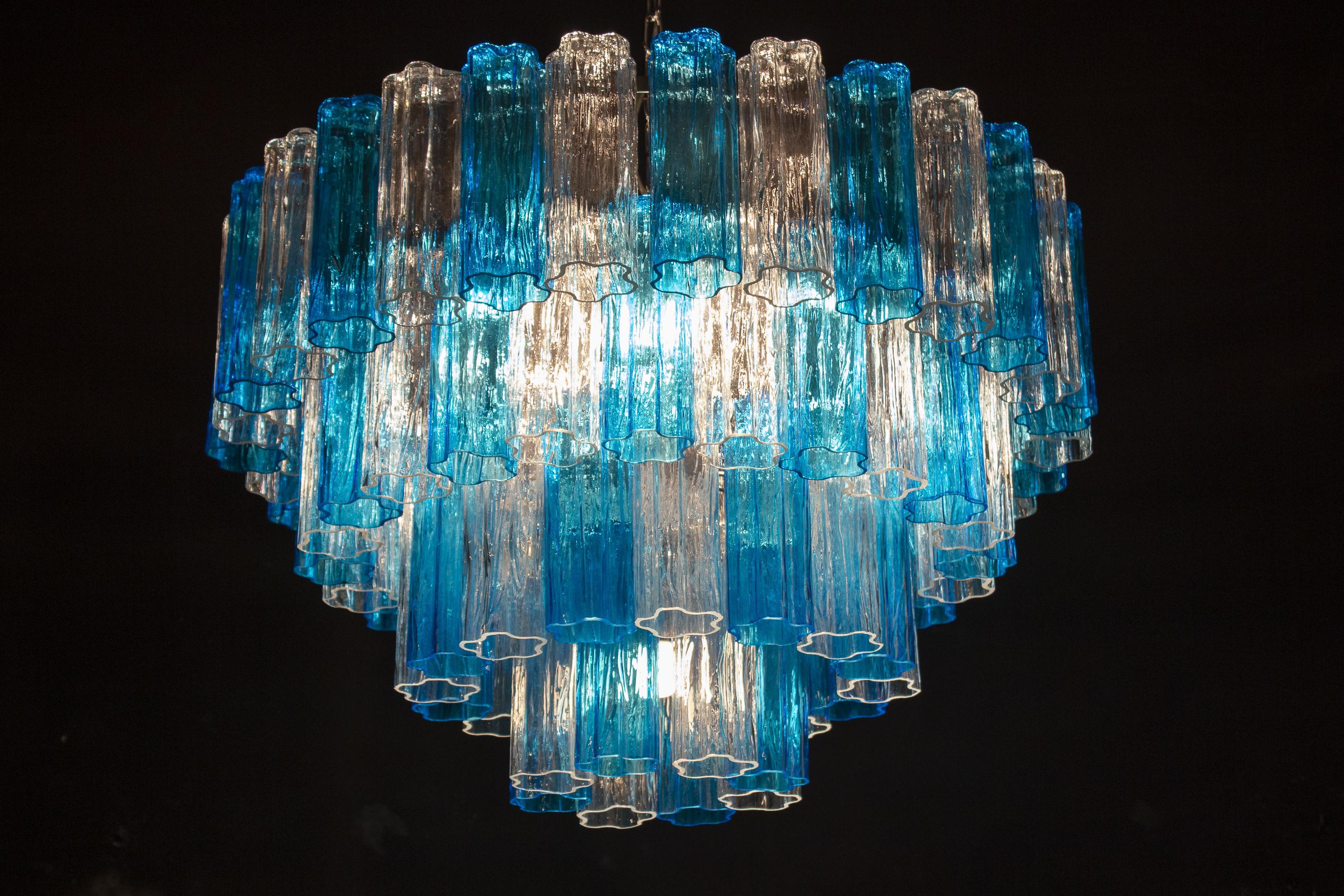 This striking chandelier is composed by 78 blue turquoise and ice color Murano glass 'Tronchi'
by 20 cm high.

 
 
