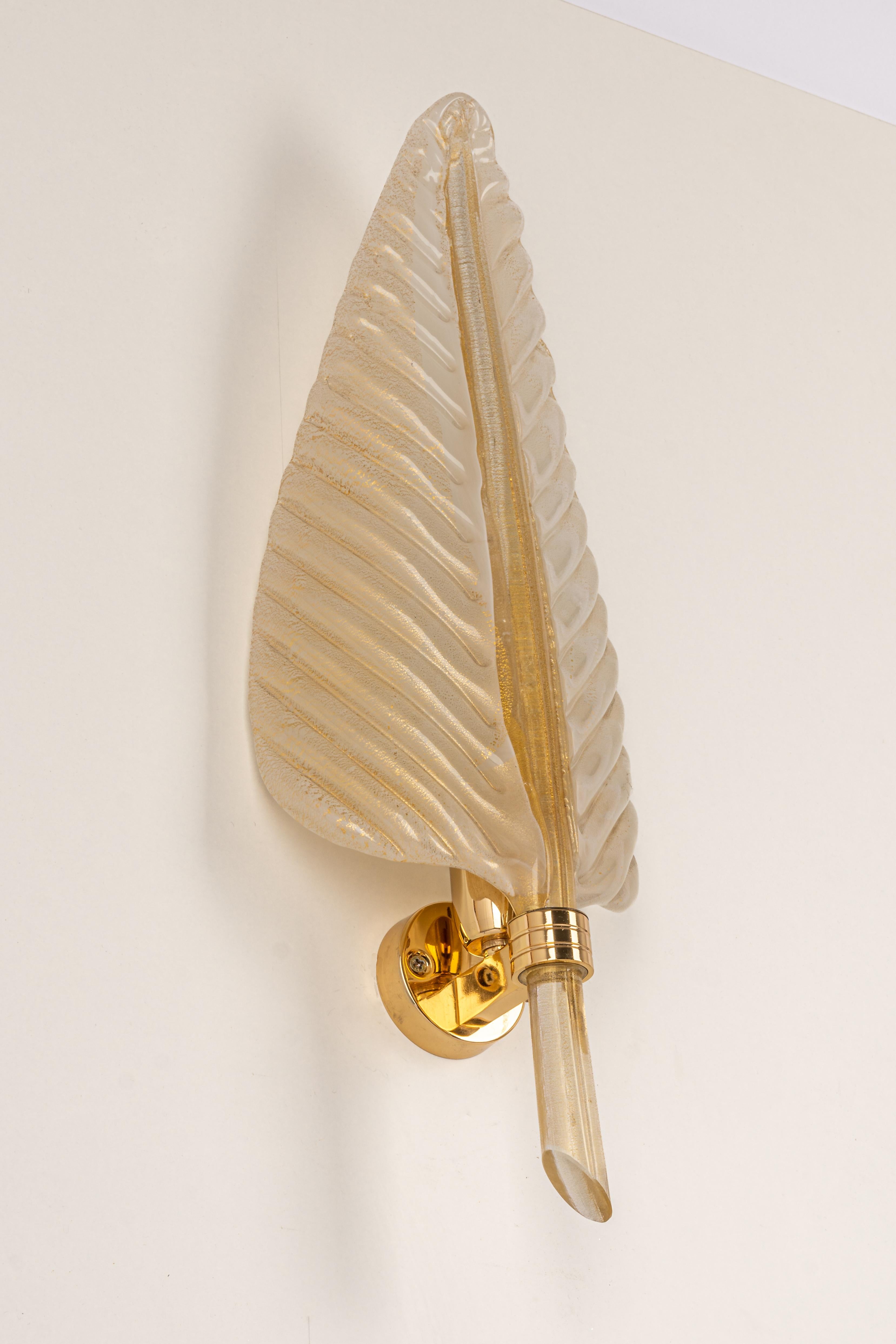 A gorgeous set of 2 sconces with 24-karat gold made by Barovier & Toso, Italy, circa 1970-1979.
High quality and in very good condition. Cleaned, well-wired and ready to use.
Each glass is unique and handmade. Therefore, there is a slight difference