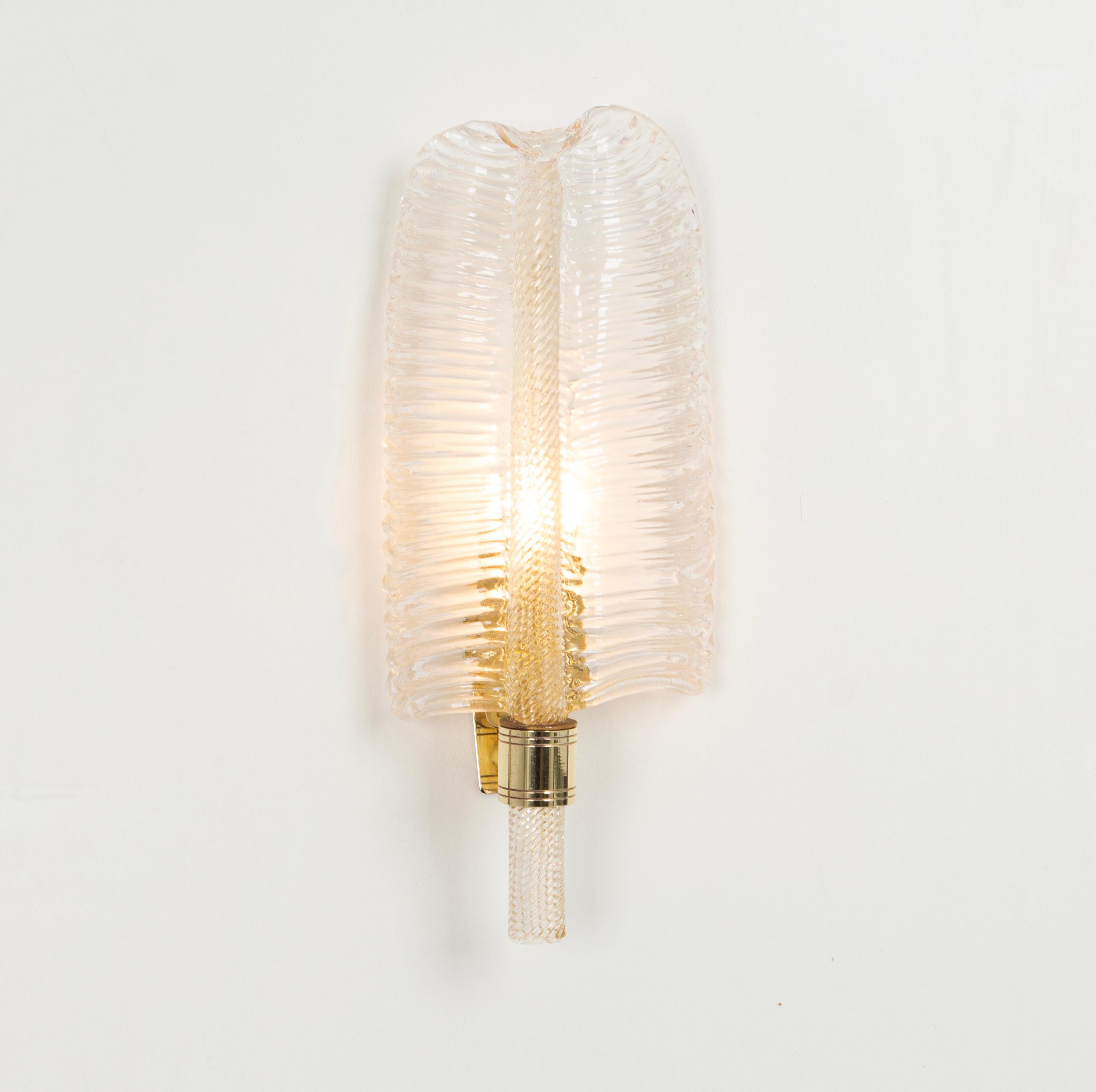 A gorgeous set of 2 sconces with 24-karat gold made by Barovier & Toso, Italy, circa 1970-1979.
High quality and in very good condition. Cleaned, well-wired and ready to use.
Each glass is unique and handmade. 

Each sconce requires 1 x E14 standard