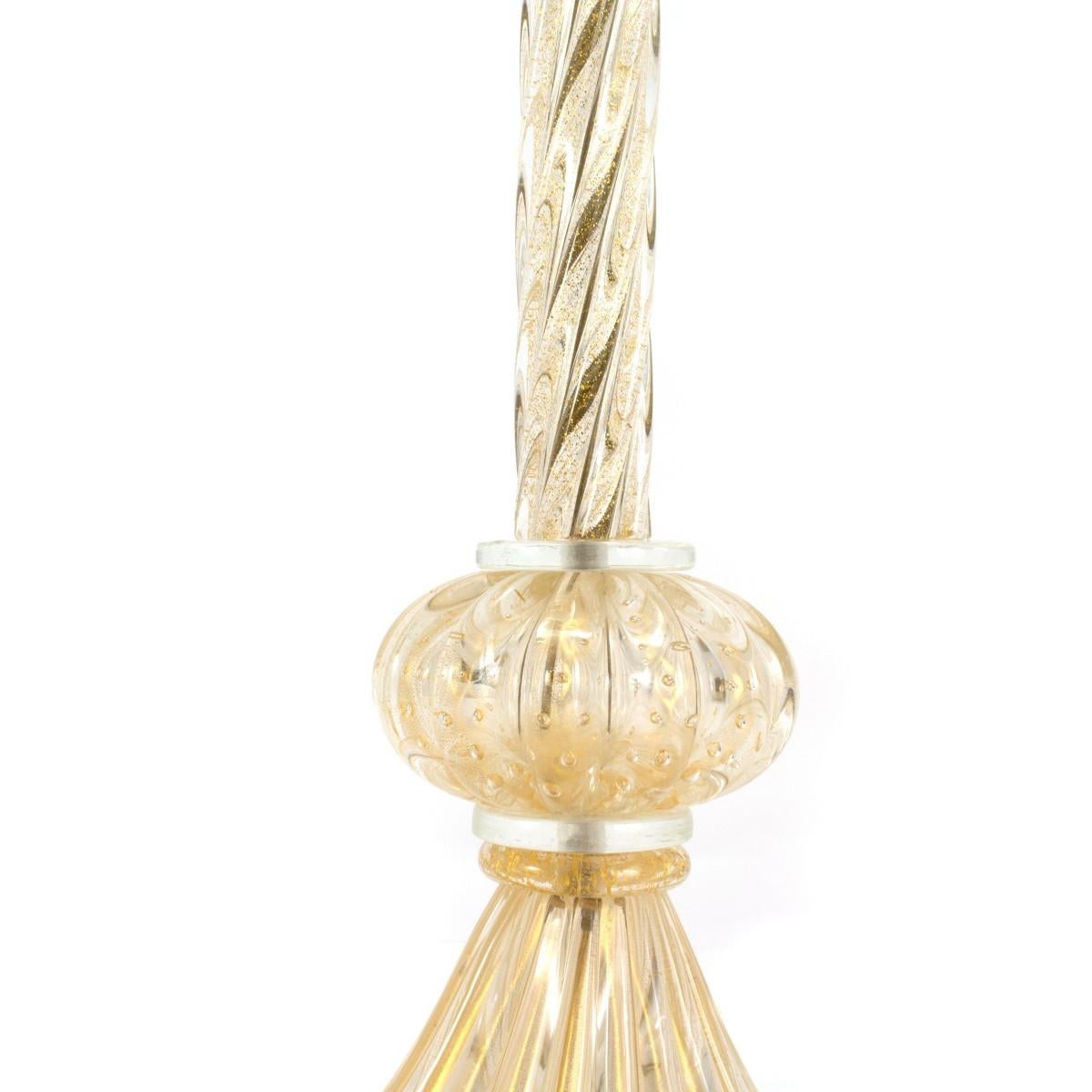 Pair of Murano glass table lamps with gold flecks, Italy, circa 1950. Drum shades included.