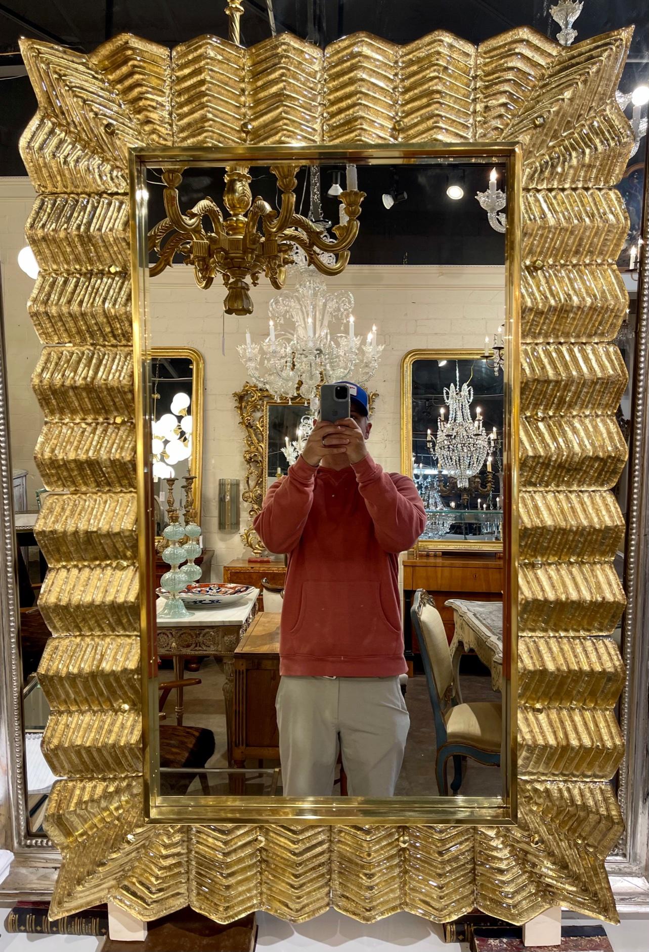 Pair of modern Murano gold leaf glass and brass mirrors. Circa 2000. A favorite of top designers. These are available in other custom colors. 
Note: sold individually.