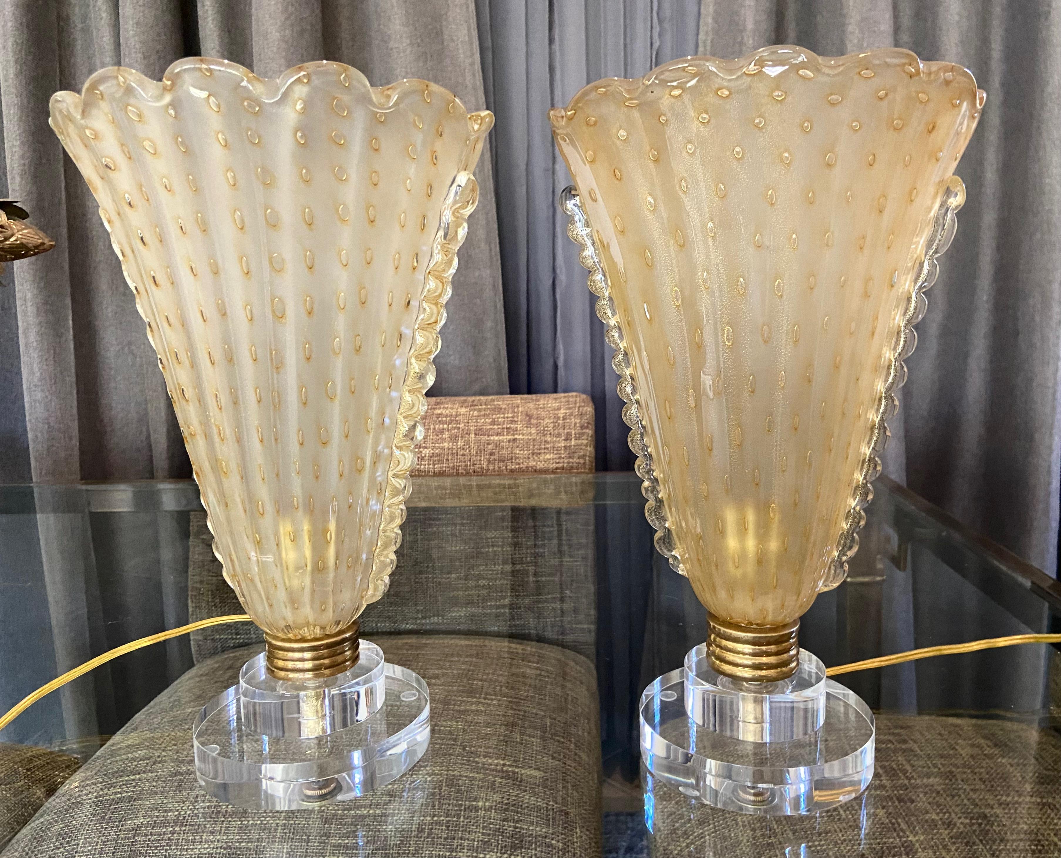 Pair of Murano art glass torchere mantel or table lamps. Italian hand blown yellow colored shades with bullicante bubbles and gold inclusions. Mounted on new acrylic bases with new brass sockets and twisted rayon cords attached with dimmers.