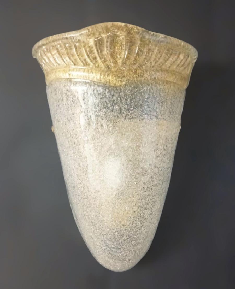 Vintage Italian Murano glass shield wall light hand blown with clear and amber graniglia to produce granular textured effect / Made in Italy in the style of Barovier e Toso, circa 1960s
Measures: Height 12 inches, width 9 inches, depth 5 inches
1