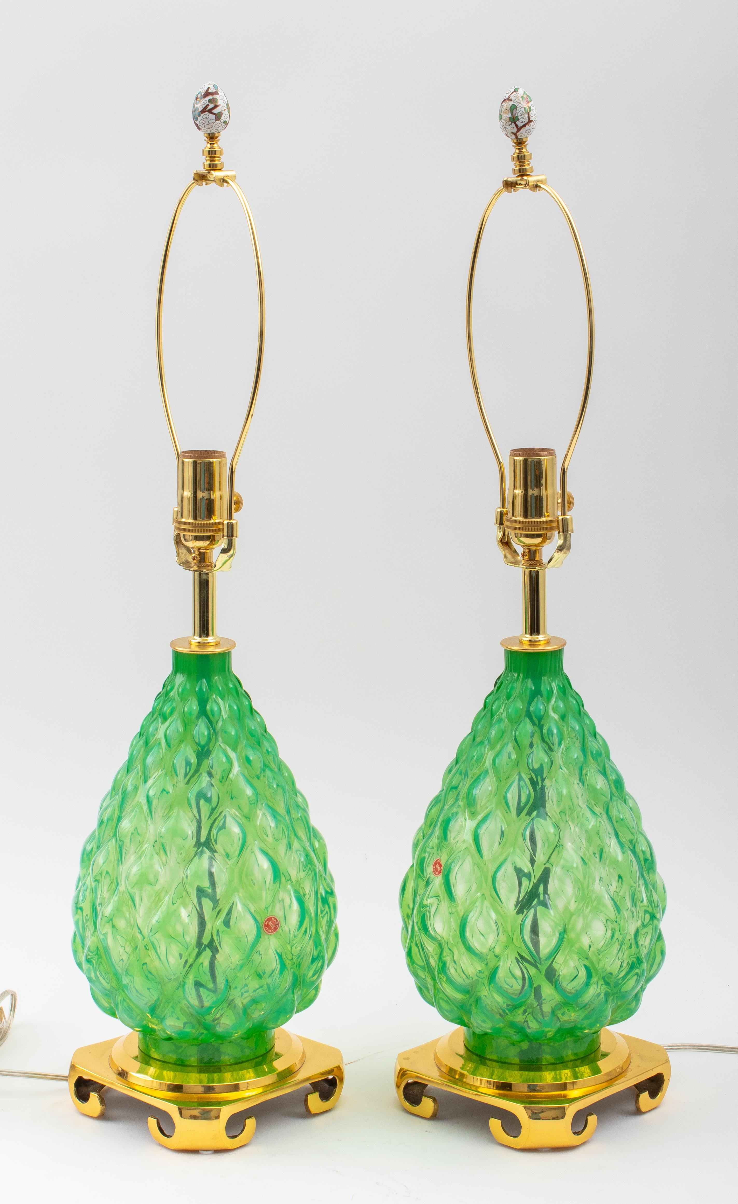 Pair of Murano green glass lamps. Made in Italy in the 1960's. Recently Rewired with high quality parts. Heavy cast brass bases.