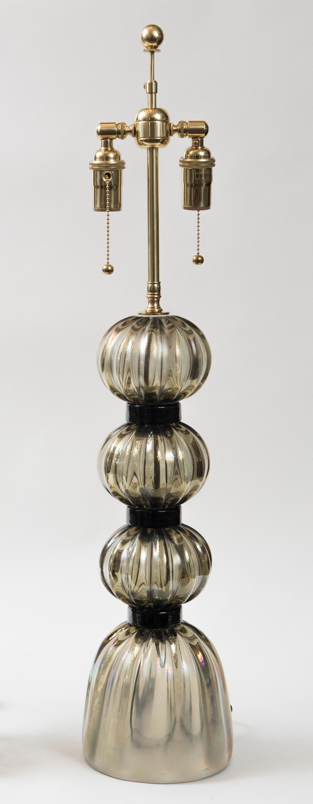 Beautiful pair of artisan blown iridescent gray ball lamps with black glass fittings
Newly re-electrified to code with UL approved parts, hardware is polished brass
Note: this is very strong thickly blown and cast glass and an amazing color that
