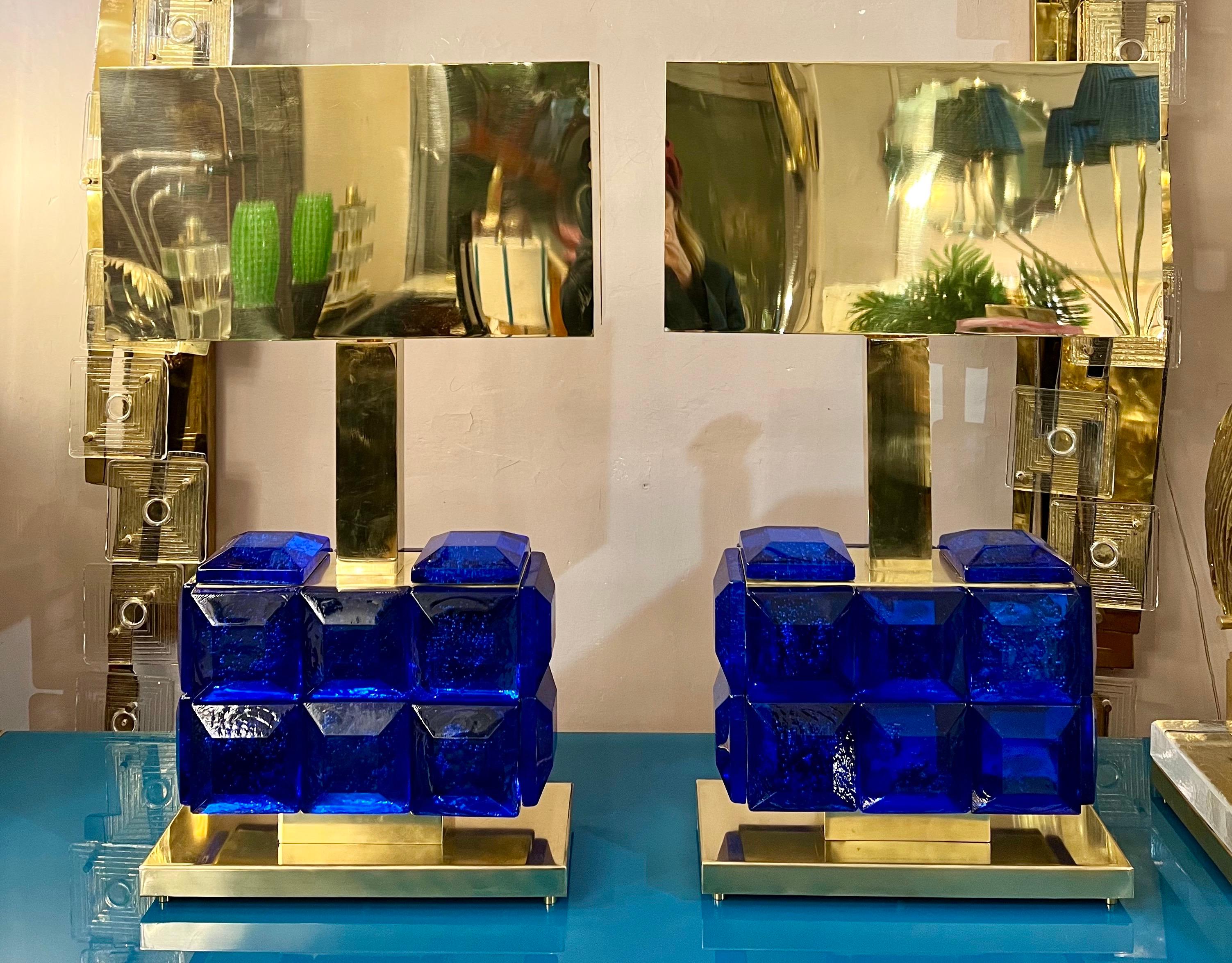 Pair of Murano table lamps with blue glass faceted diamond, rectangular shape. Brass fittings and brass rectangular lampshades.
    