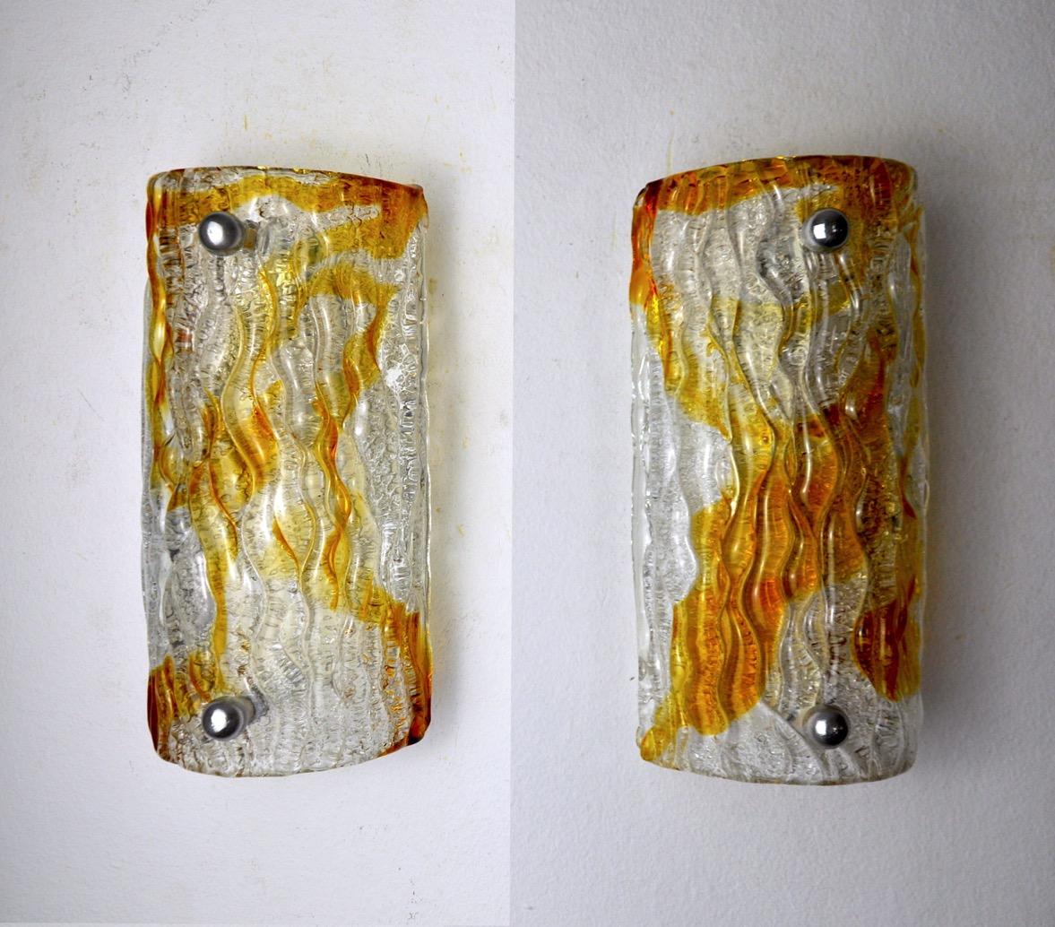 Very nice pair of mazzega murano frosted sconces designed and produced in murano, italy in the 60s. This magnificent pair of sconces is composed of an orange frosted murano glass crystal supported on a chromed metal structure. Rare design object