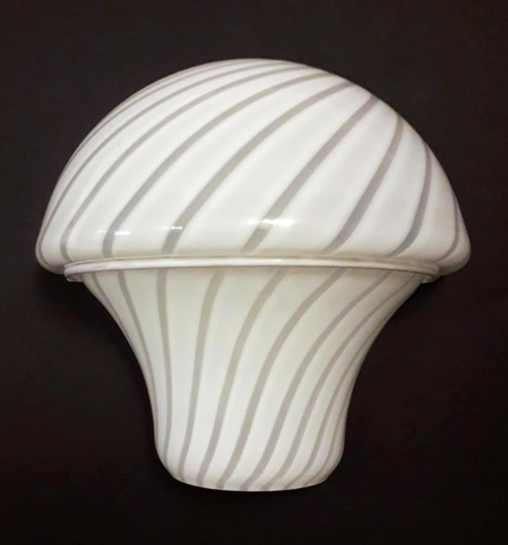 Vintage Italian wall lights with mushroom shaped milky white Murano glass diffusers hand blown with clear stripes / Made in Italy, circa 1960s
Measures: height 8 inches, width 8 inches, depth 4 inches
1 light / E12 or E14 type / max 40W
2 pairs