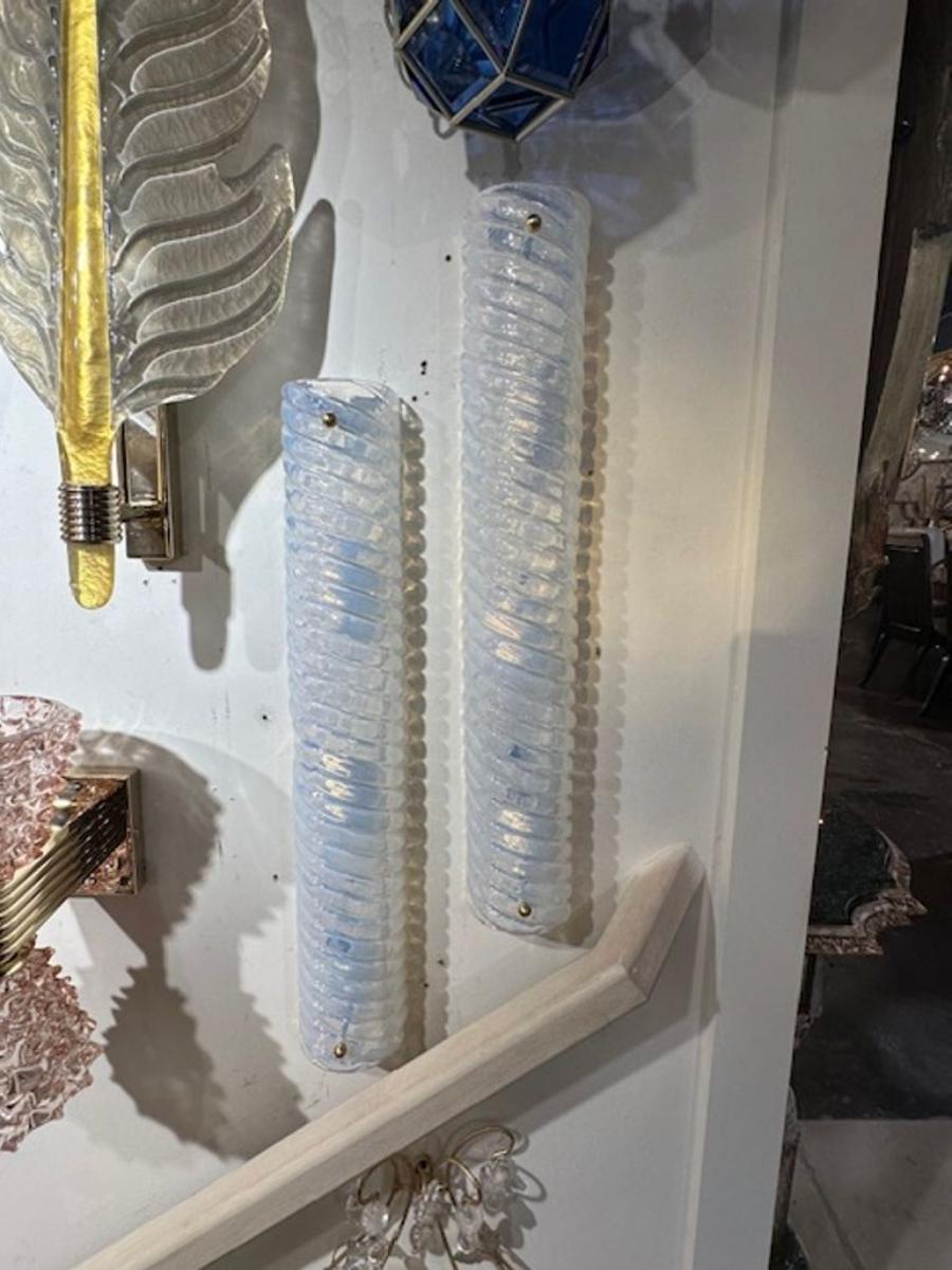 Pair of modern Murano swirl opalescent glass barrel sconces. The sconces have been professionally rewired and ready to hang.