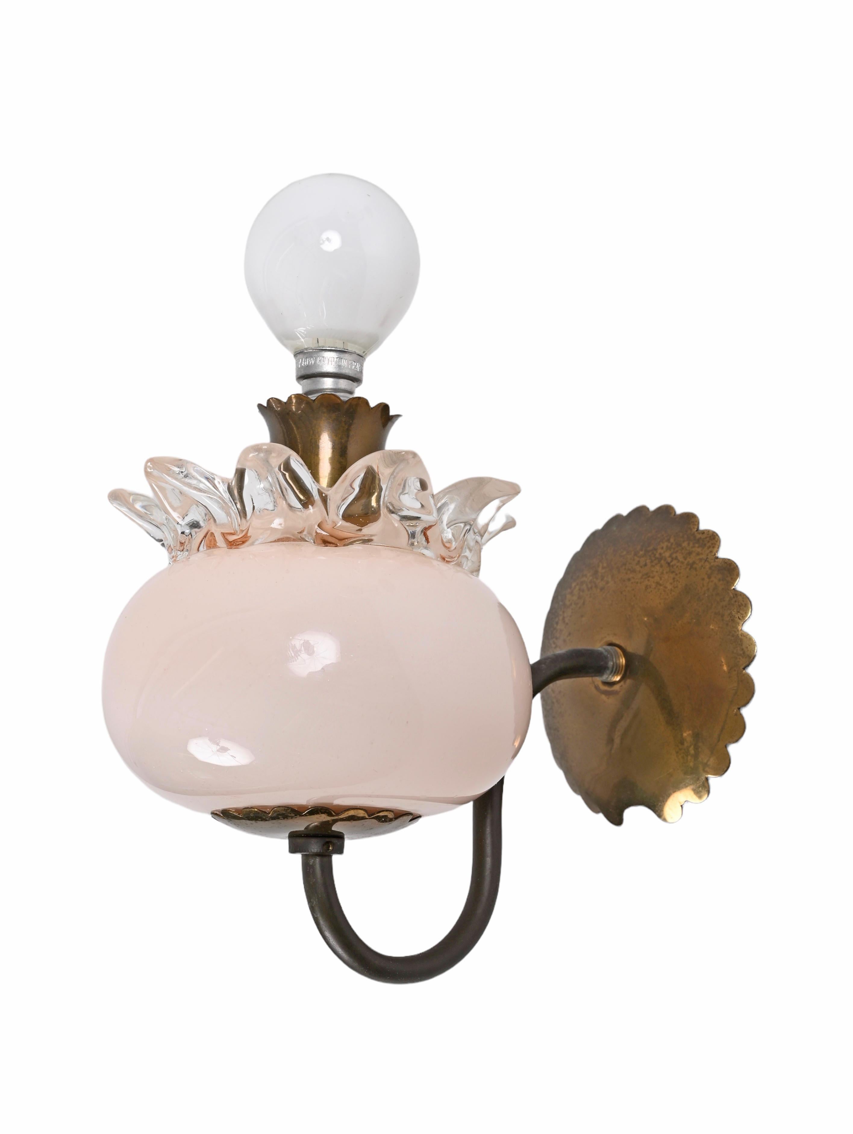 Wonderful pair of Murano pink glass and brass sconces. Archimede Seguso probably designed this fabulous pair of items during the 1940s in Murano, Italy.

This set is amazing as it is made of amazing Murano pink glass with astonishing crystal glass