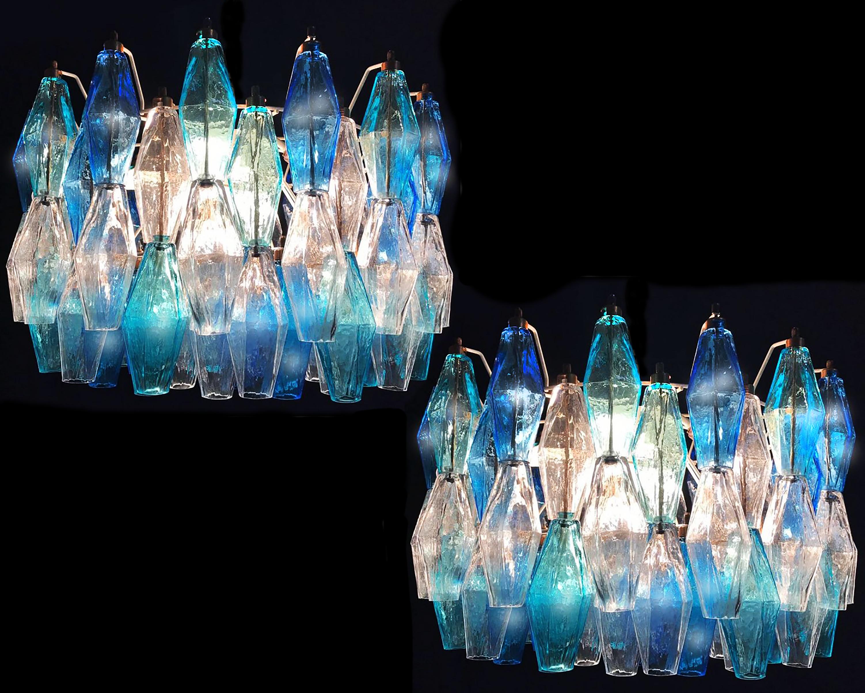 Each chandelier consists of 52 colored Poliedri of Murano. Ice, blue and aquamarine. Measures: cm H 80, L 50, W 35 height lights without chain 30 cm.