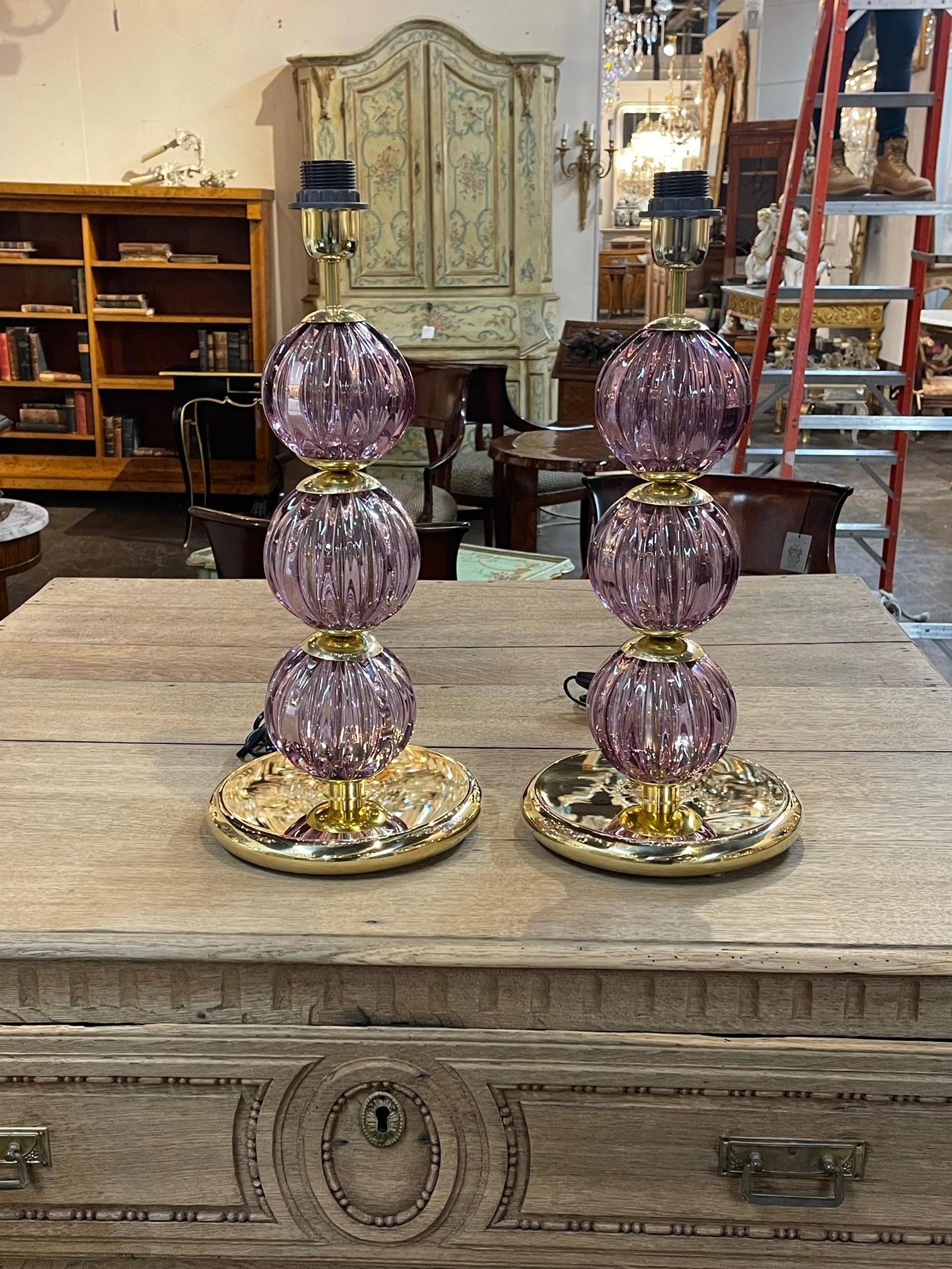 Pair of modern Murano purple glass and brass ball lamps, Circa 2000. This pair of lamps is wired for the USA and ready to go. A fine addition to any home.