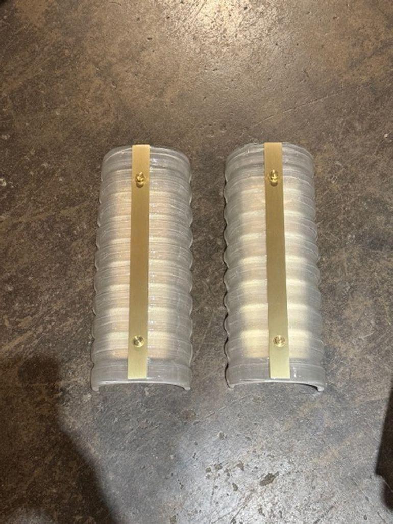 Pair of modern Murano ribbed glass and brass barrel sconces. Perfect for today's transitional designs!