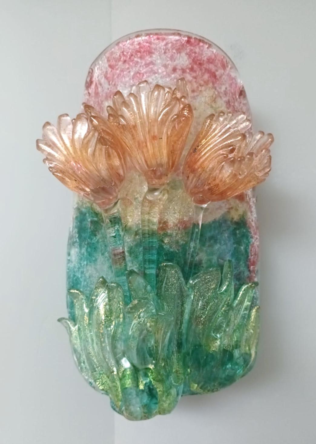 Vintage Italian wall lights with hand blown clear pink and green Murano glass shades infused with gold, to form lovely three tulips / Made in Italy, circa 1960s
Measures: Height 12 inches, width 7 inches, depth 5.5 inches, backplate diameter