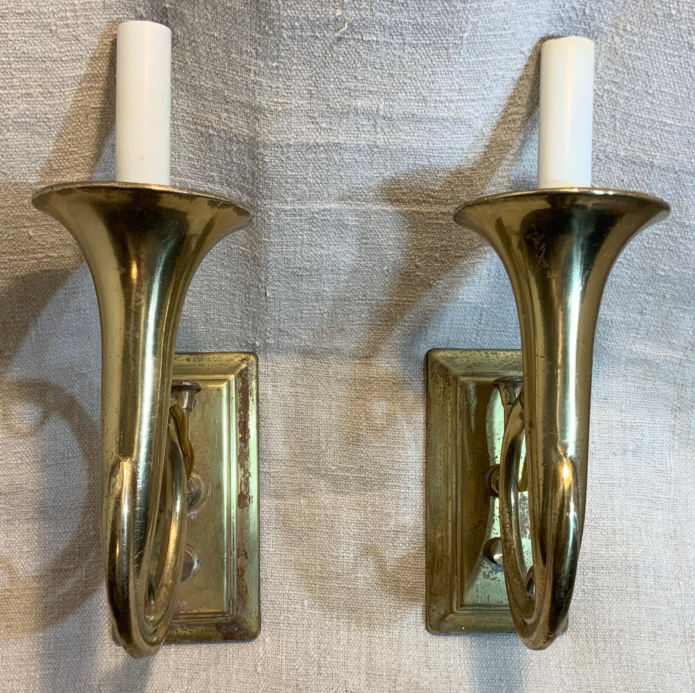 Unusual pair of musical wall sconces, look like trumpet. Made of solid brass
One 60/watt light each.
Ready to light.
Backplate size 3” x 6”.