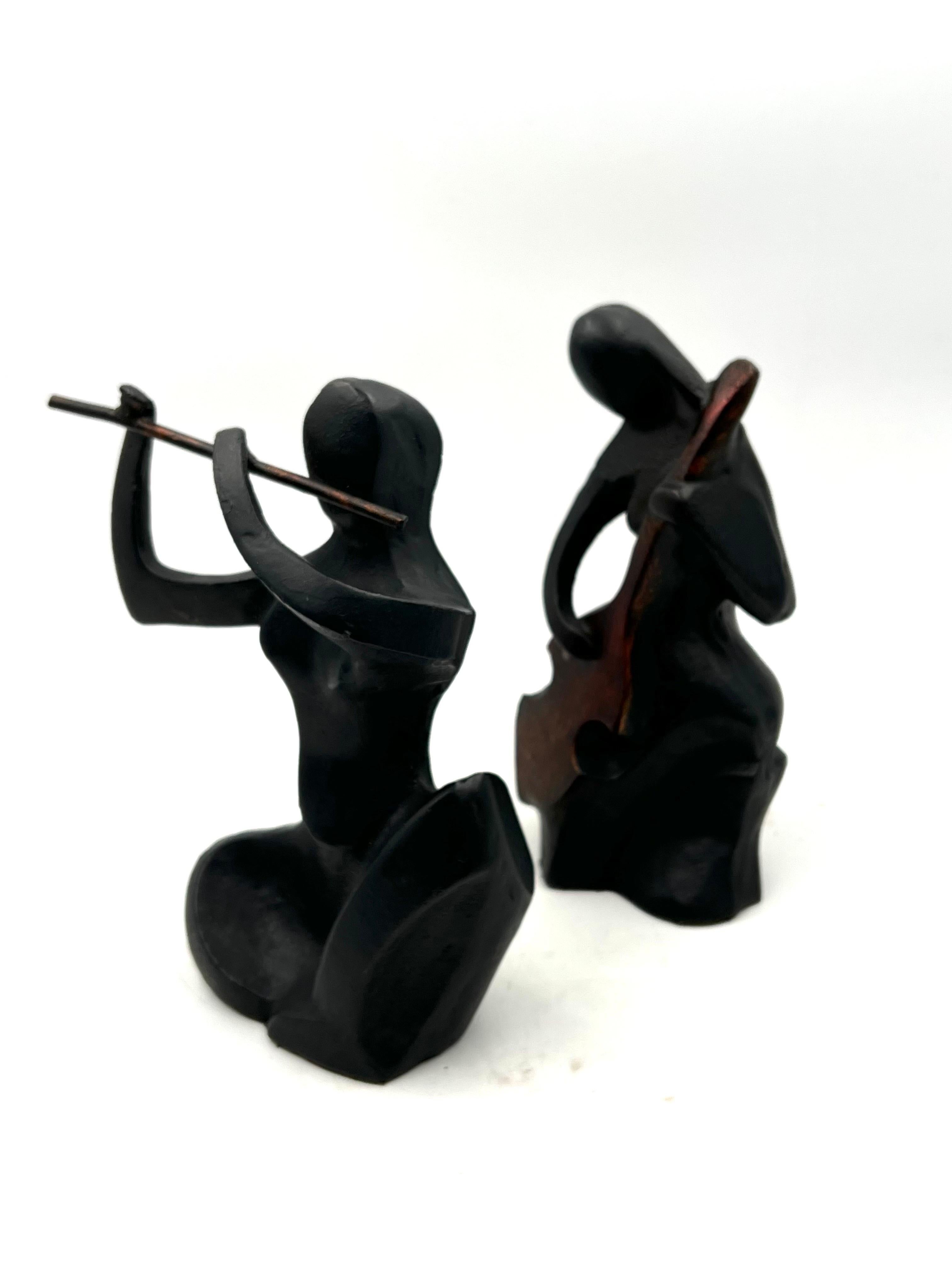 Nice pair of cast iron musicians, men, and woman the pair had a label that read made in Italy but it got lost.