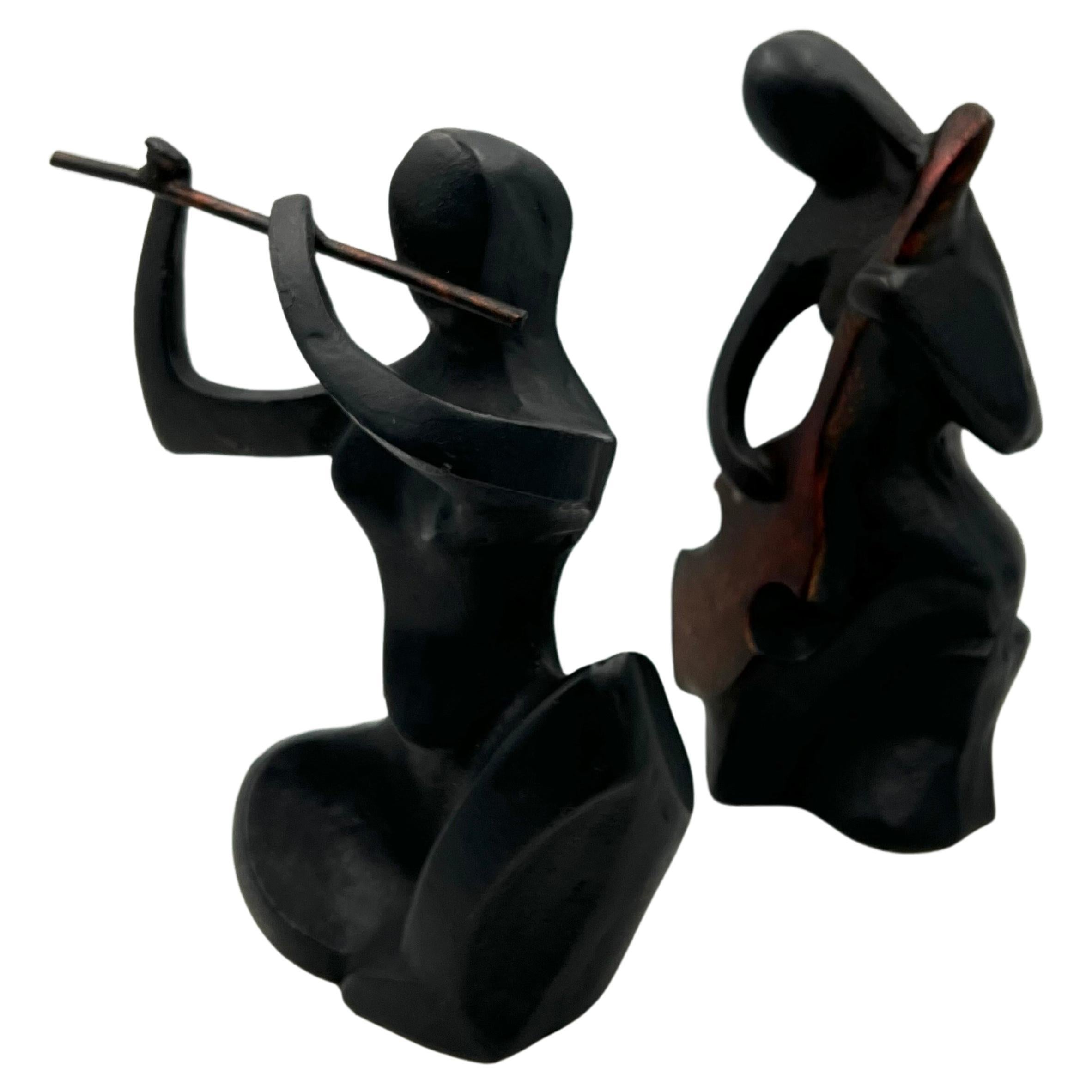 Ein Paar Musiker, Moderne Buchstützen-Skulpturen aus Gusseisen, Mitte des Jahrhunderts