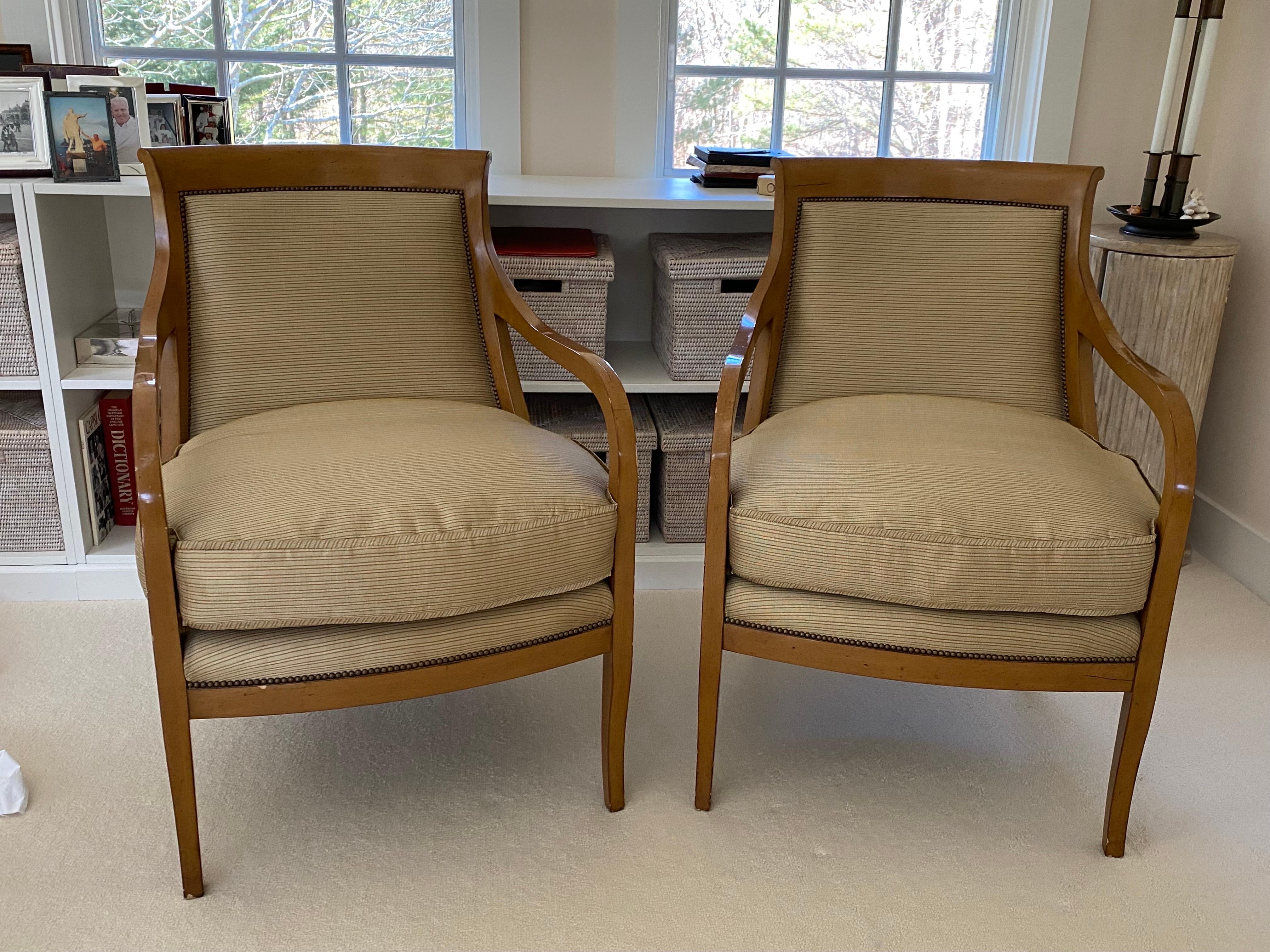 Pair of Nancy Corzine '2003 Napoleon Lounge' Chairs in Silk Fabric. 
Silk flange edging on cushion. Fabric in very good condition. Some dings and losses to legs and finish on frame. Structurally sound.

Measures: 25.25