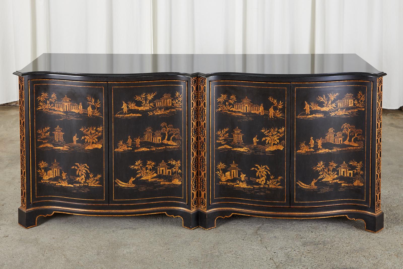 Spectacular pair of large sideboard chests, buffets, or credenzas featuring hand-painted parcel gilt chinoiserie reserves by Nancy Corzine. The bespoke cabinets have a serpentine front with four large doors separated by columns of Chinese