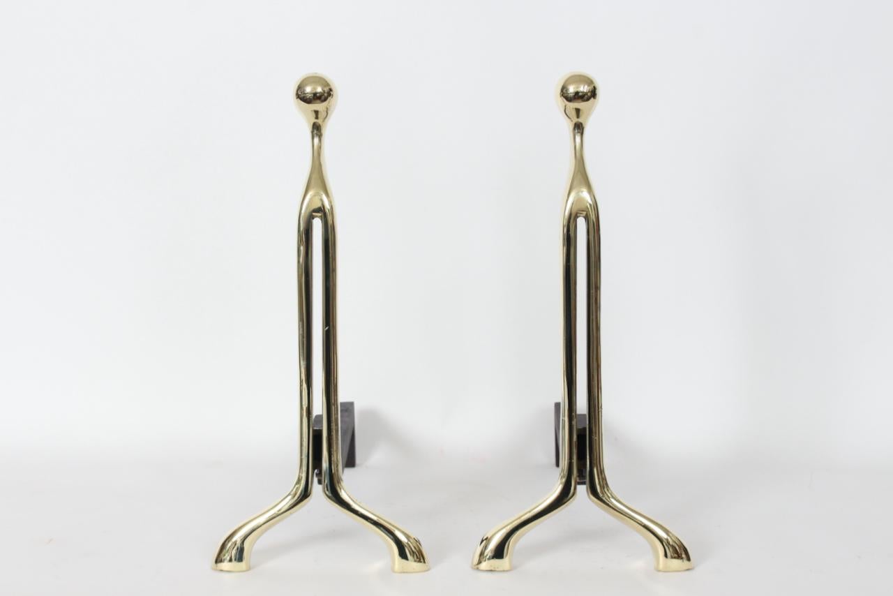 Pair Nancy Ruben of Bennington Bronze for Virginia Metalcrafters Brass Fireplace Andirons.  Featuring a balanced, sculptural,Art Nouveau inspired curved design, rounded Brass heads, a top sturdy long cast iron legs for burning wooden logs. Front of