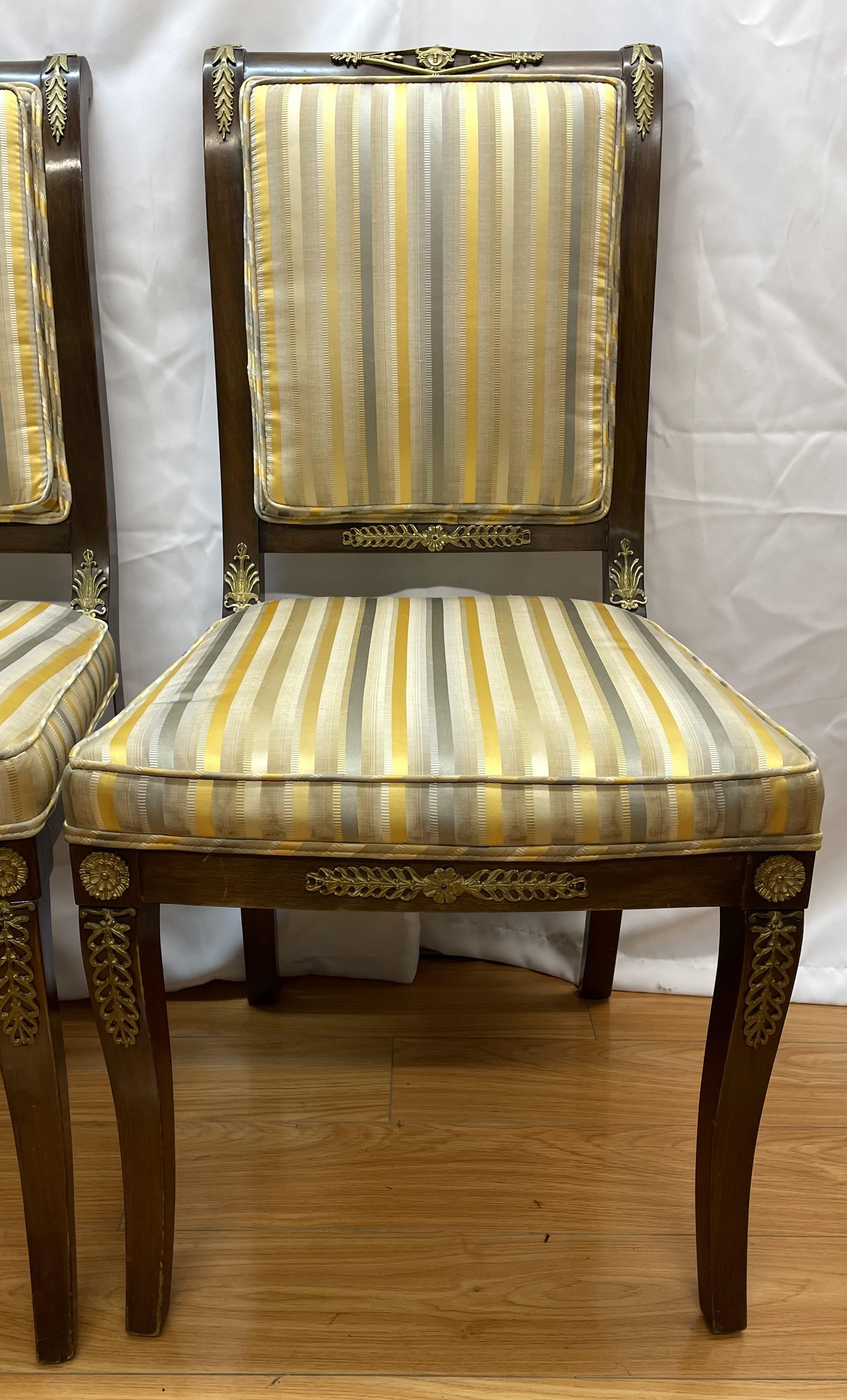 Pair of Napoleanic - style stripped side chairs with gilded ormolu mounts

Upholstered in silf fabrics 

20 x 20 x 38