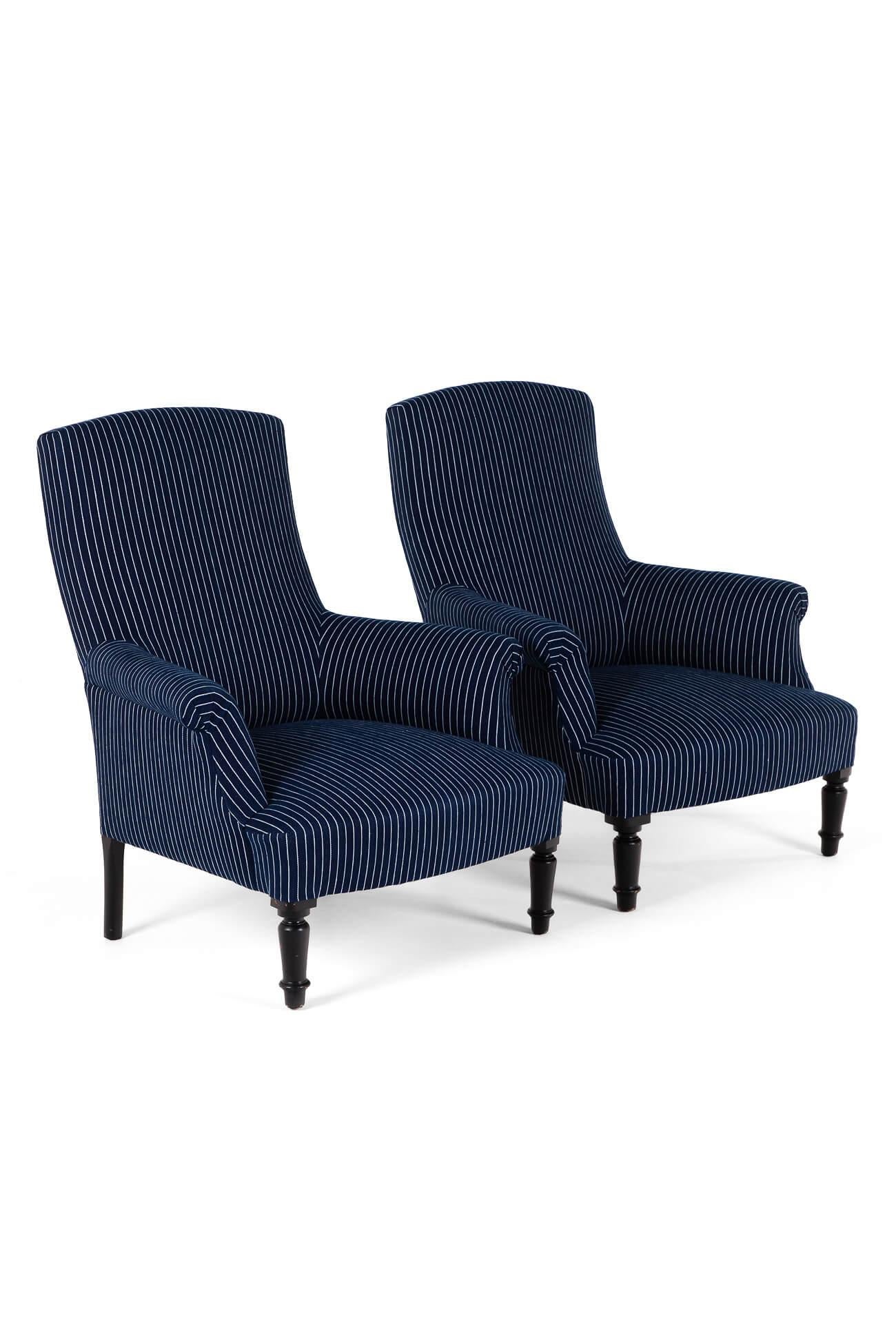 A pair of stunning 19th century French Napoleon III square back armchairs on turned ebonised legs.

Fully reupholstered with hessian and calico to the walnut frame, finished in a woven navy and white ticking stripe.

The price is for the pair.