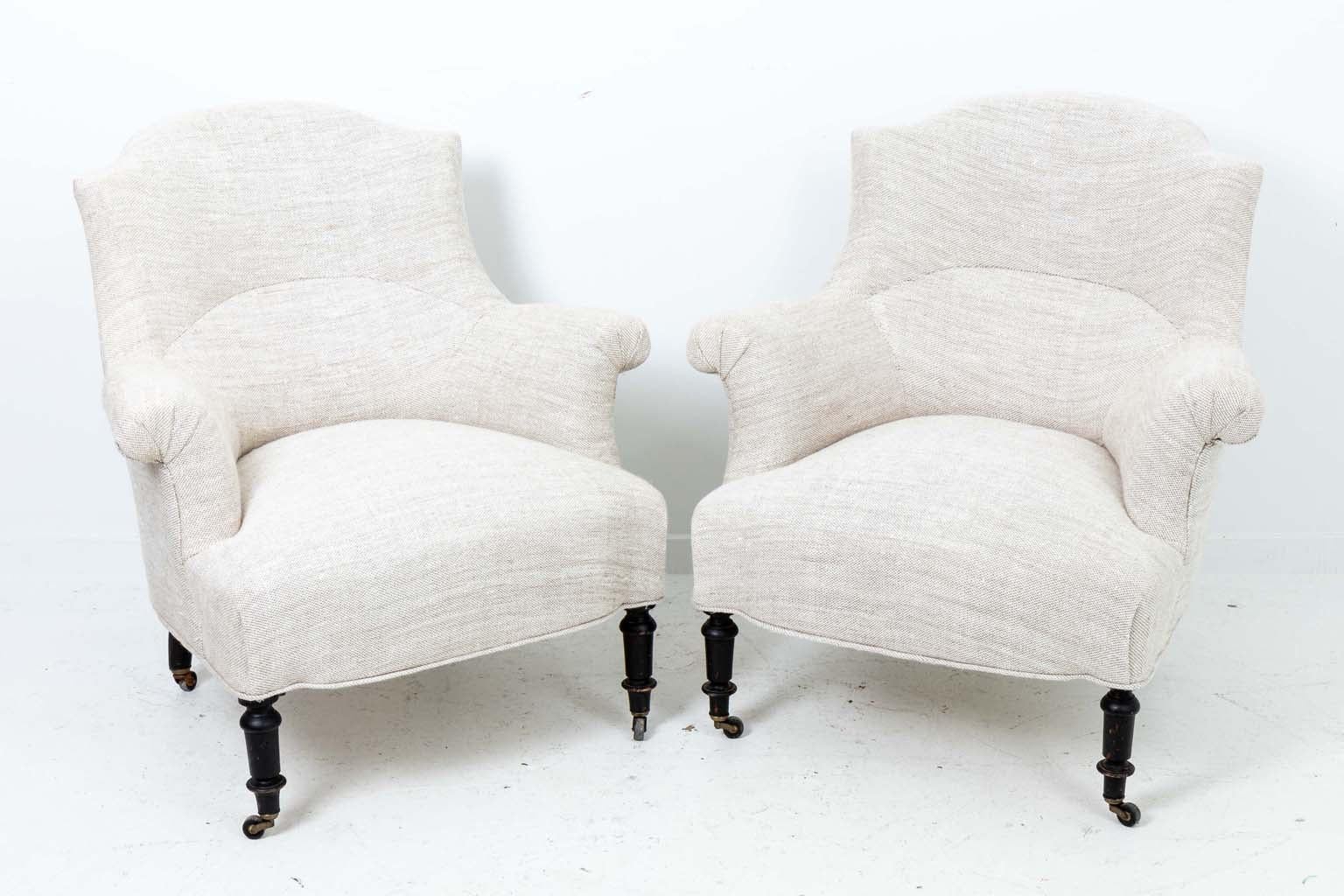 Pair of Napoleon III Arm Chairs, France 1880, freshly upholstered in heavy linen, black ebonized legs.

