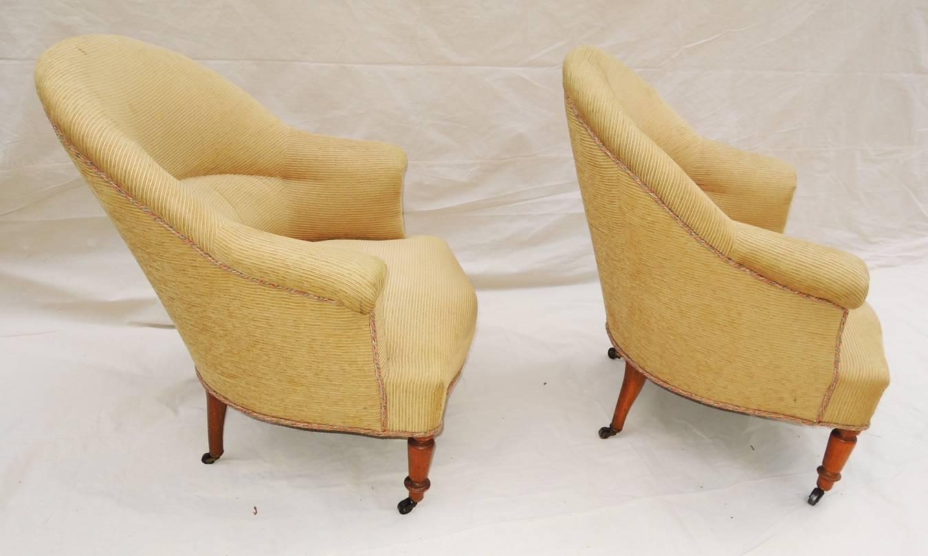 A solid pair of Napoleon III armchairs covered in pale gold corduroyed velvet, circa 1900. Original wheels. Seat hgt.: 16.5
