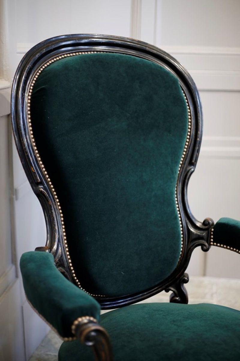 This is a simply stunning pair of Napoleon III balloon backed armchairs. The ebonised finish it totally original and has lovely wear to it. We have upholstered these in a rich green velvet by Designers guild and it doesn't streak. The chairs are a