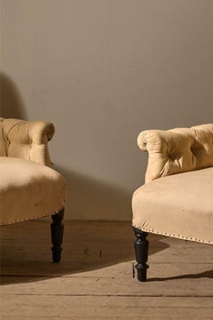 Pair of Napoleon III Buttoned curved back armchairs