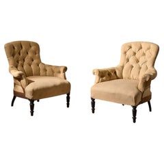 Pair of Napoleon III Buttoned curved back armchairs