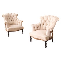 Pair of Napoleon III buttoned fishtail armchair